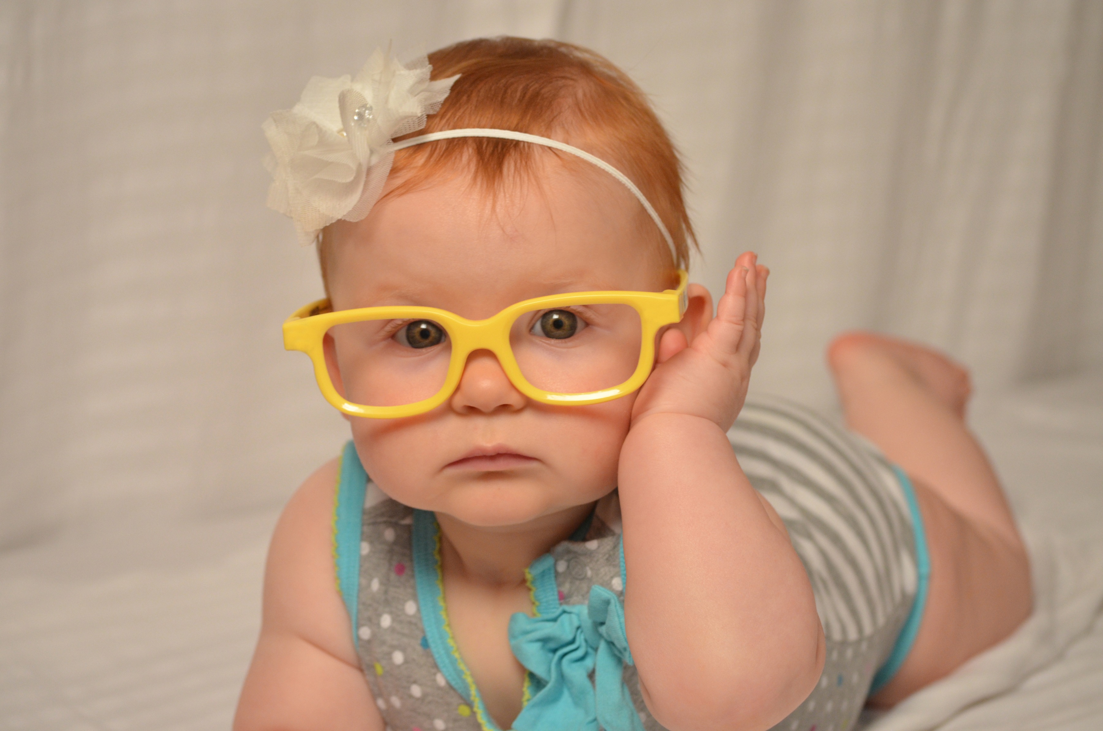 Cute baby in yellow glasses free image download