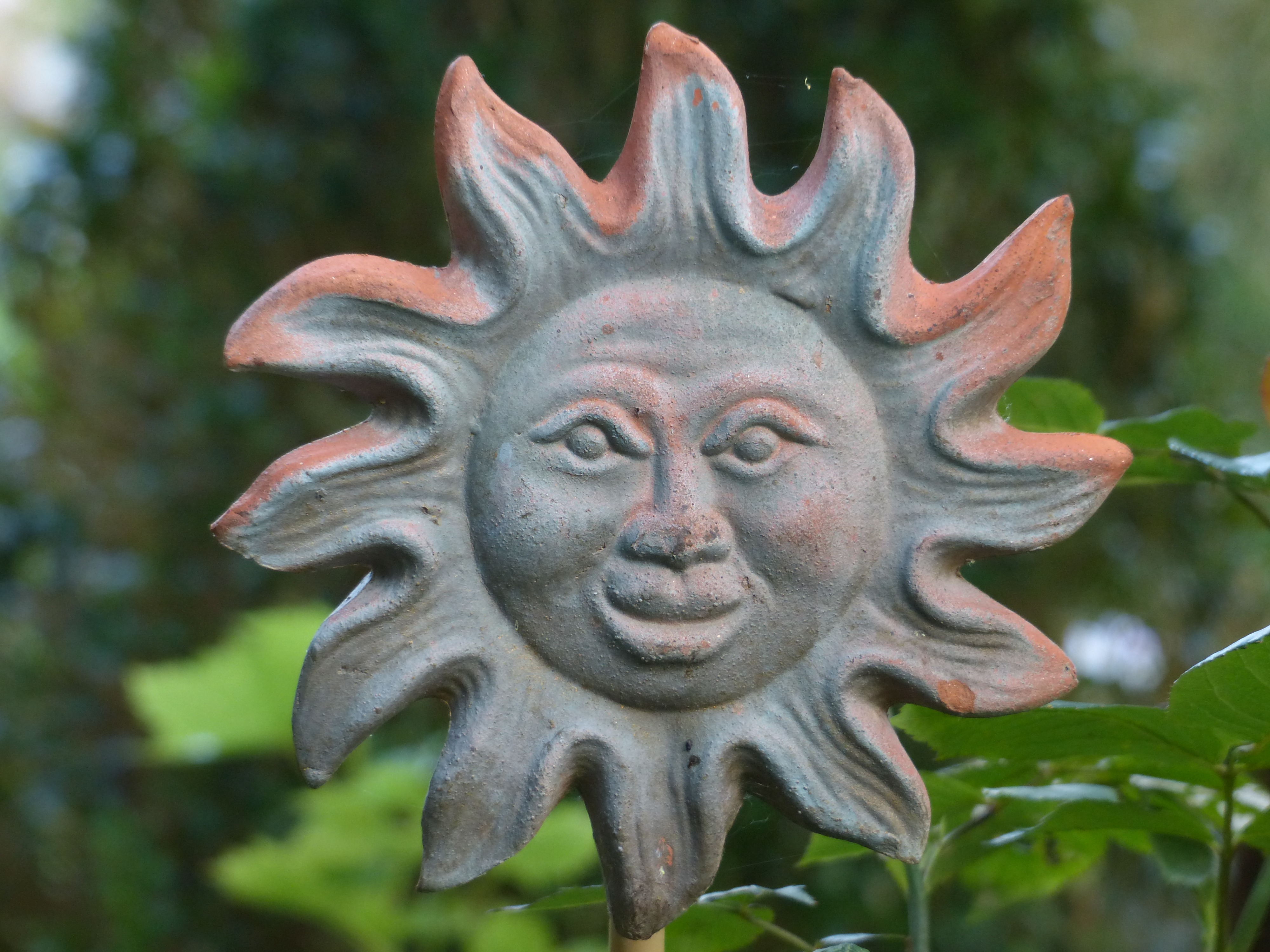 Ceramic sun in the garden free image download