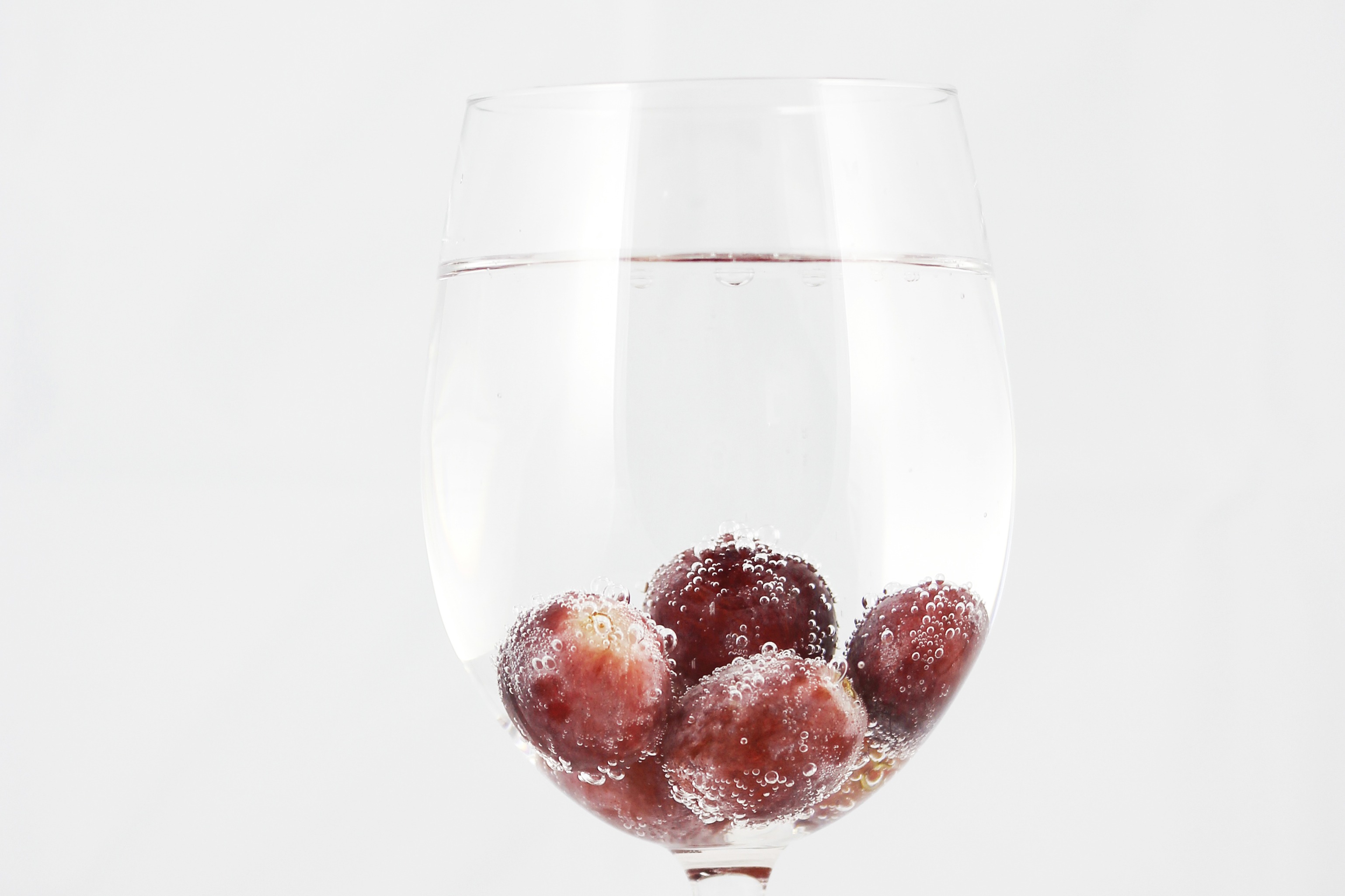 Grapes in a glass of carbonated water free image download