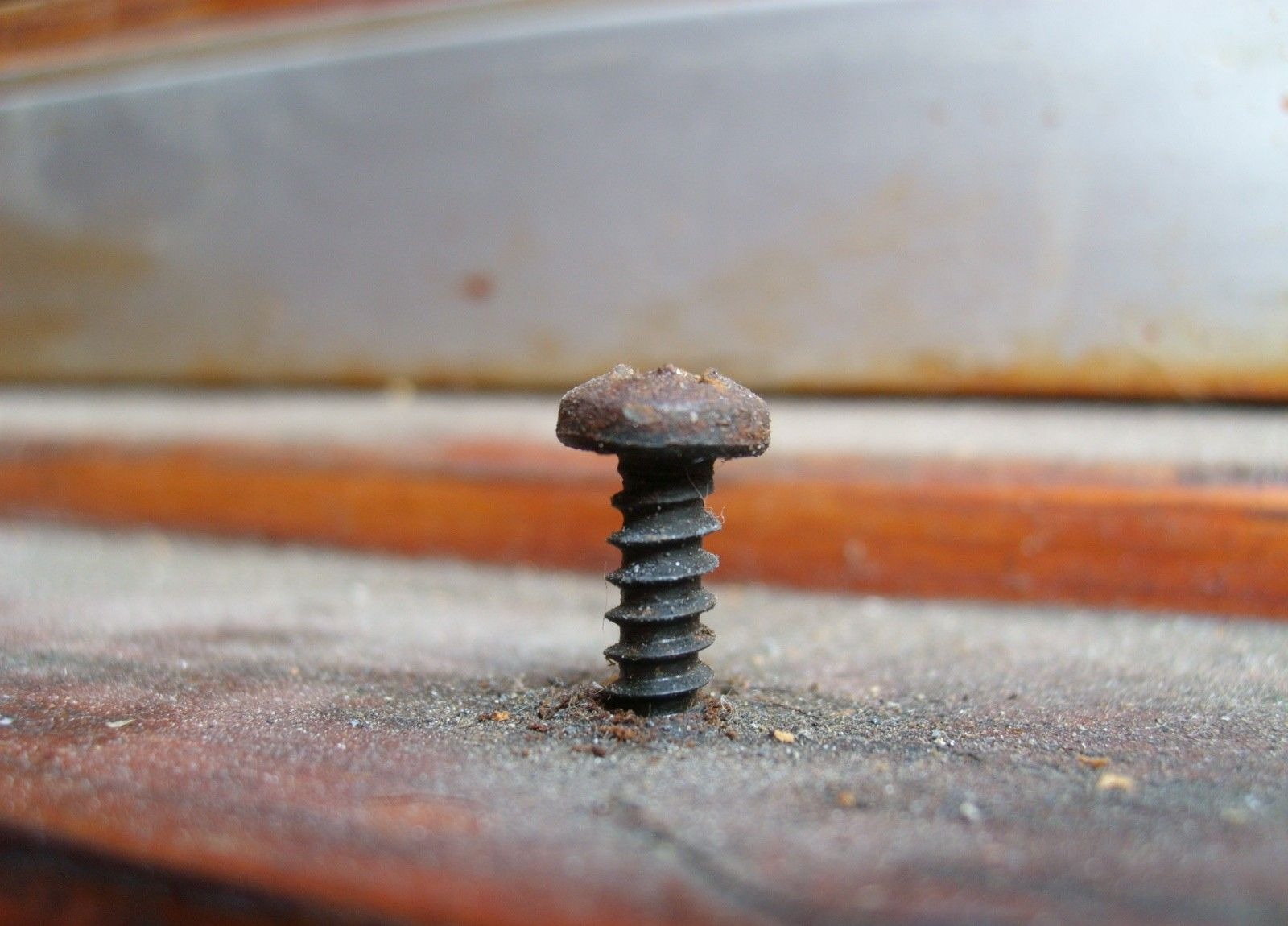 Rusty screw on the windowsill free image download