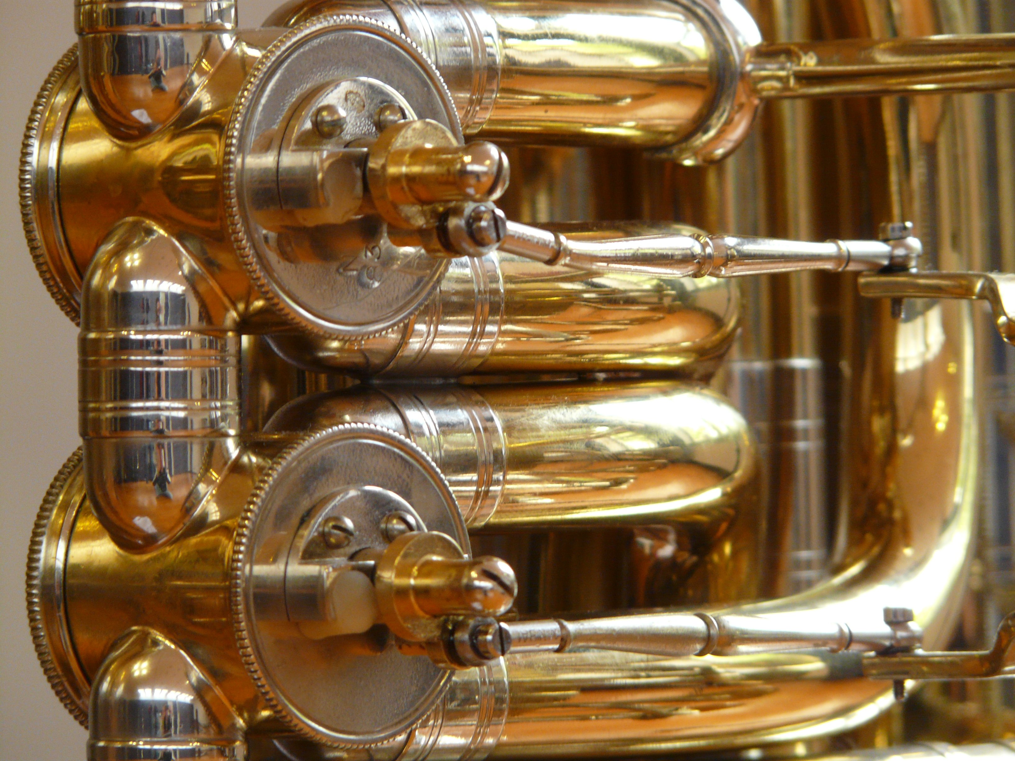 Brass valves of the musical instrument closeup free image download