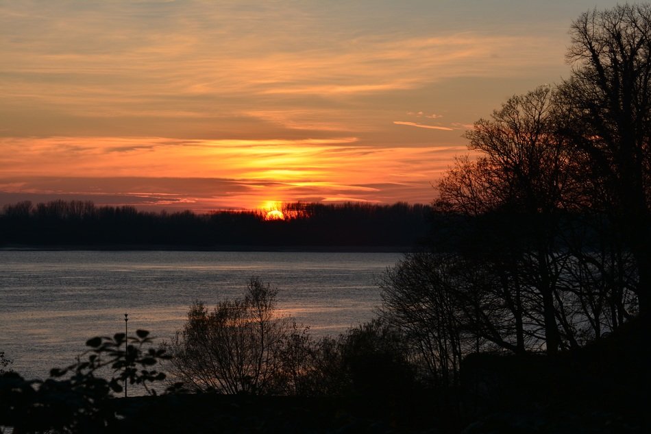 Landscape of elbe lake at the orange sunset in winter free image download