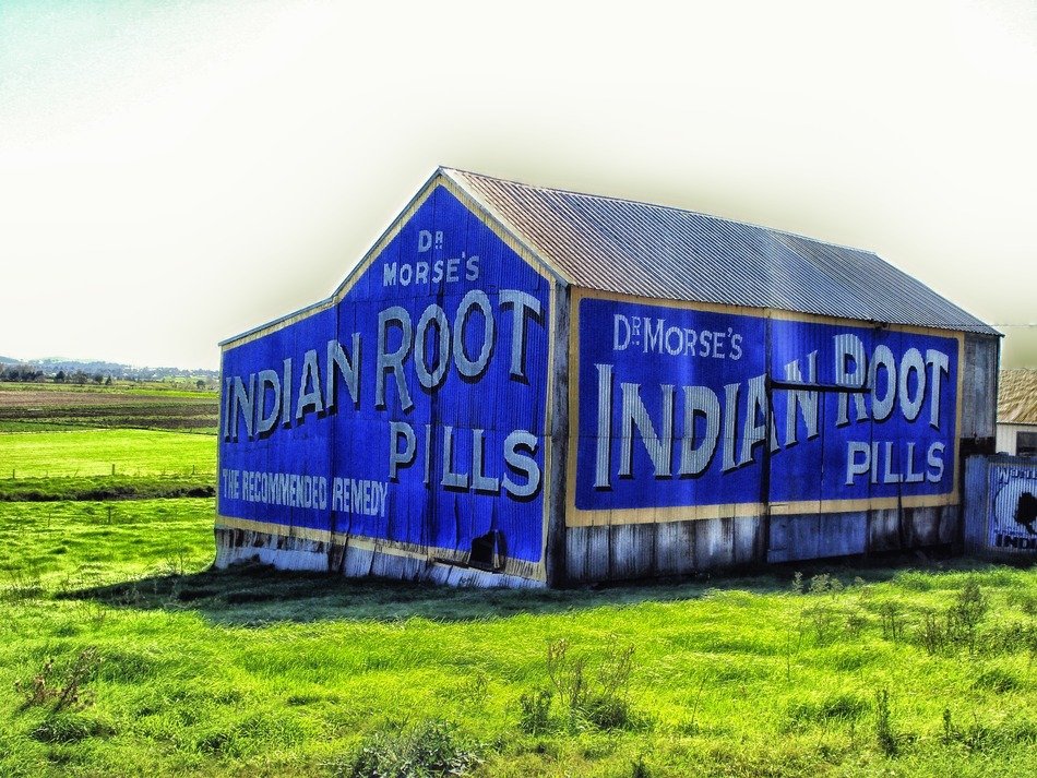 Blue barn on a green field in australia free image download