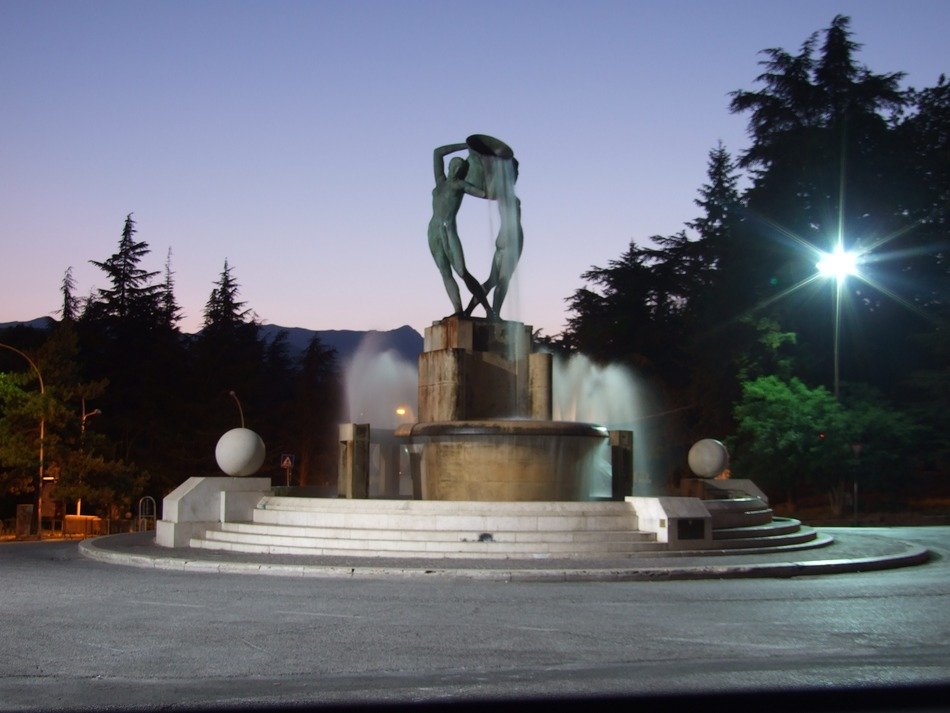Fountain with sculpture at dusk, italy, l'aquila free image download