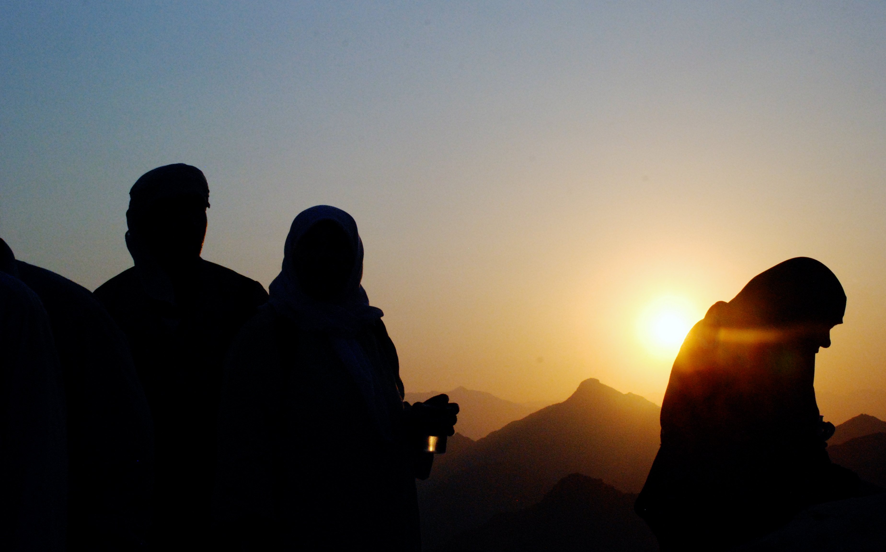 People pray at sunrise free image download