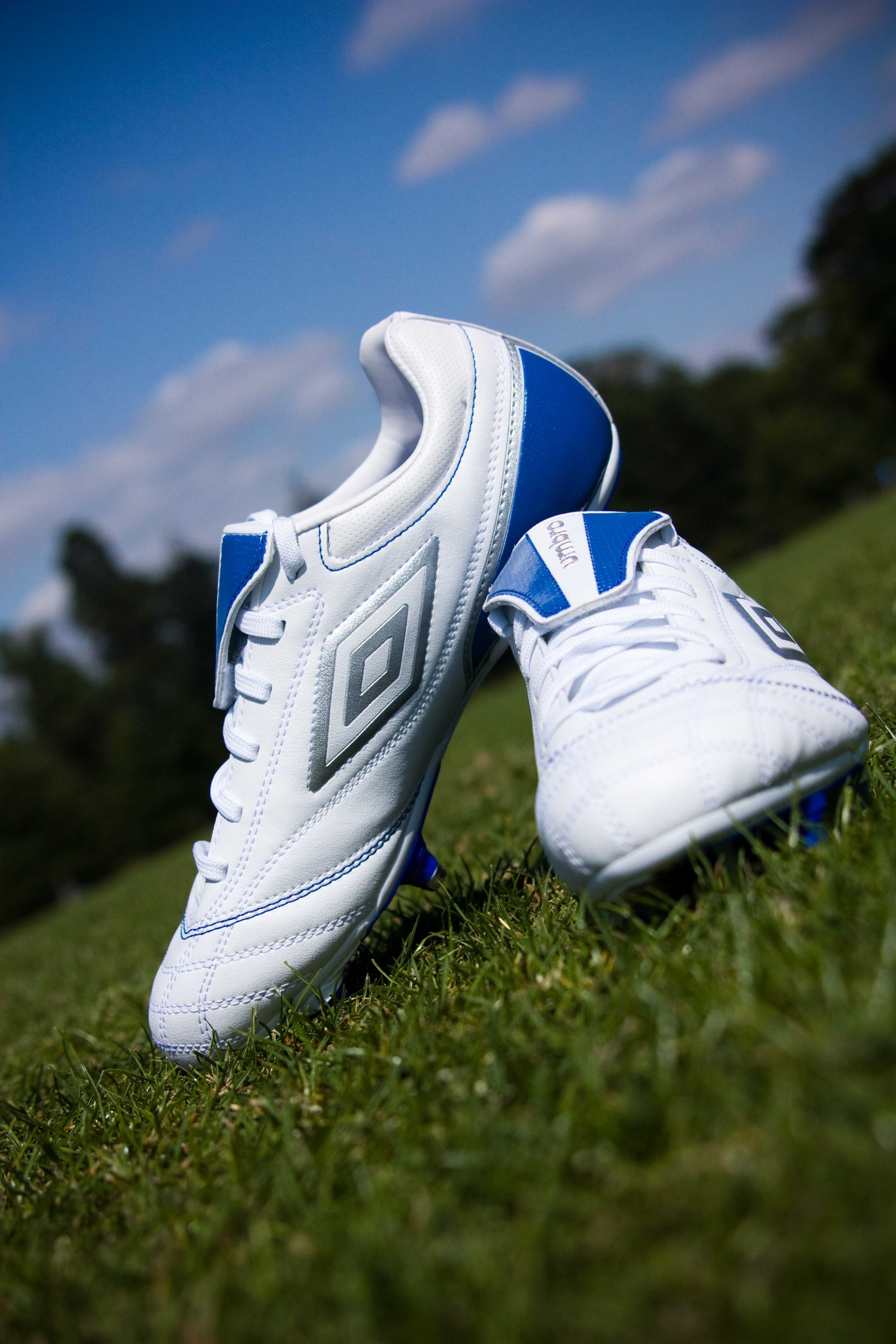 Football boots on the grass free image download