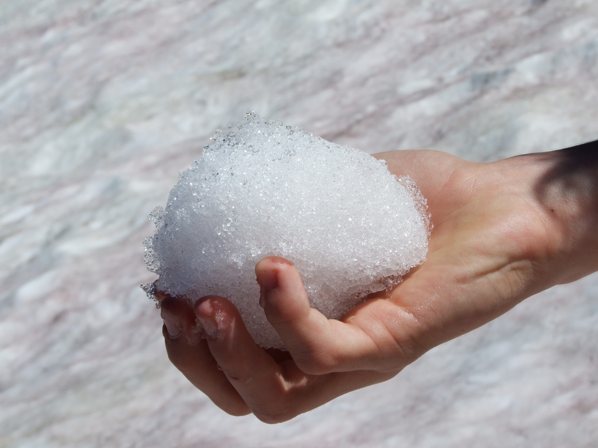 Melting snow ball in hand closeup free image download