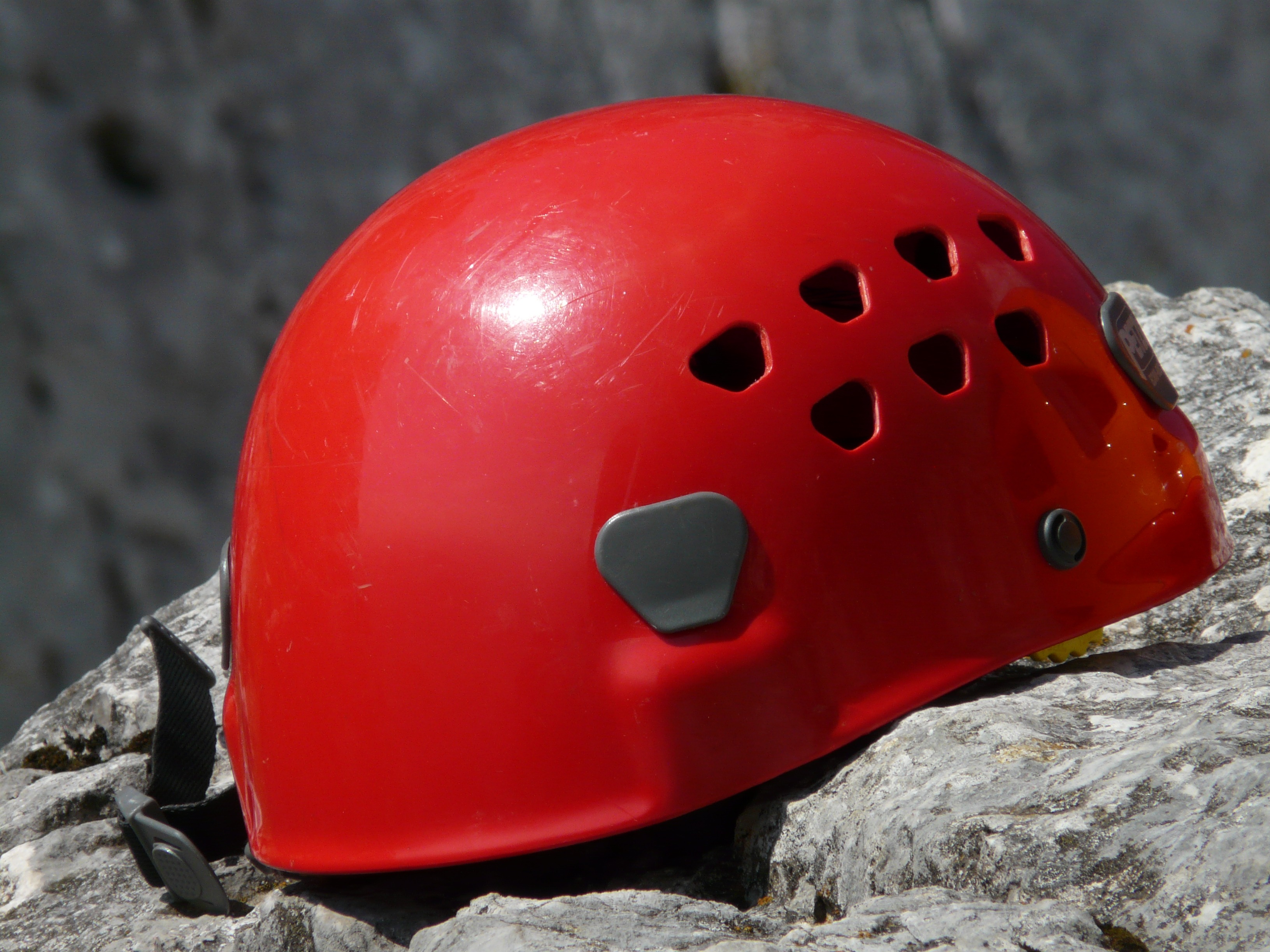 Climbing red helmet on a stone closeup free image download