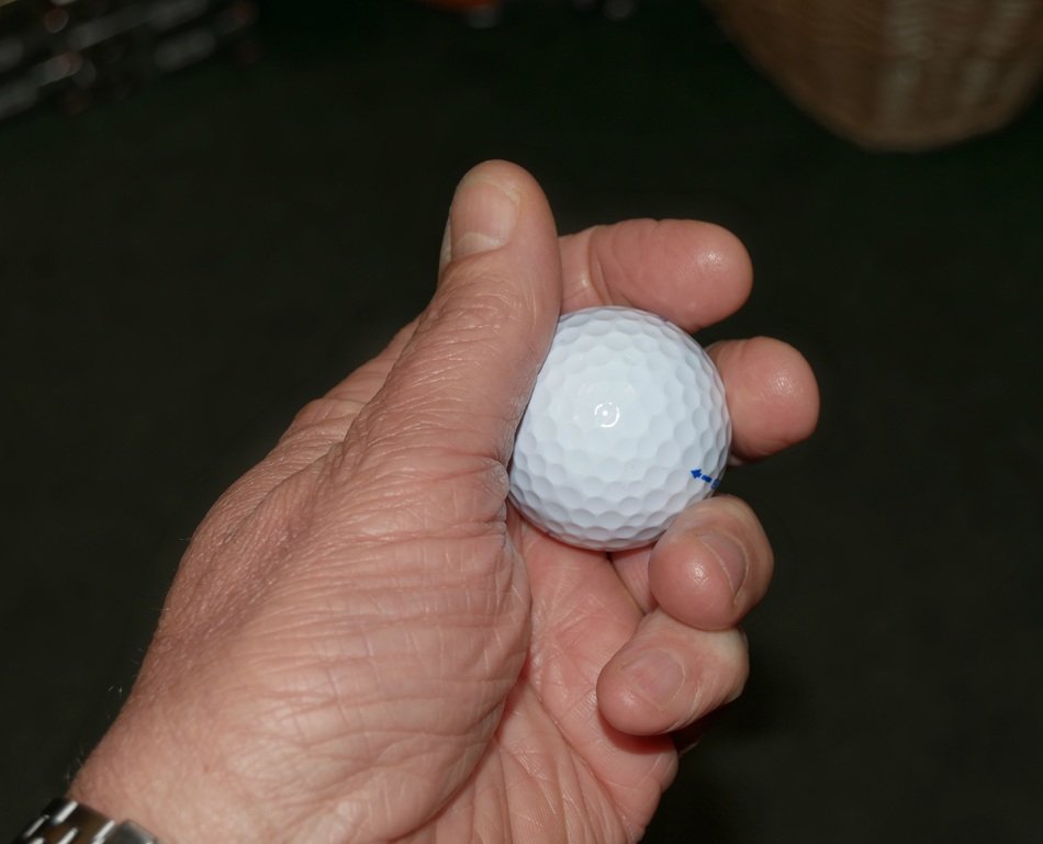 Golf ball in hand free image download