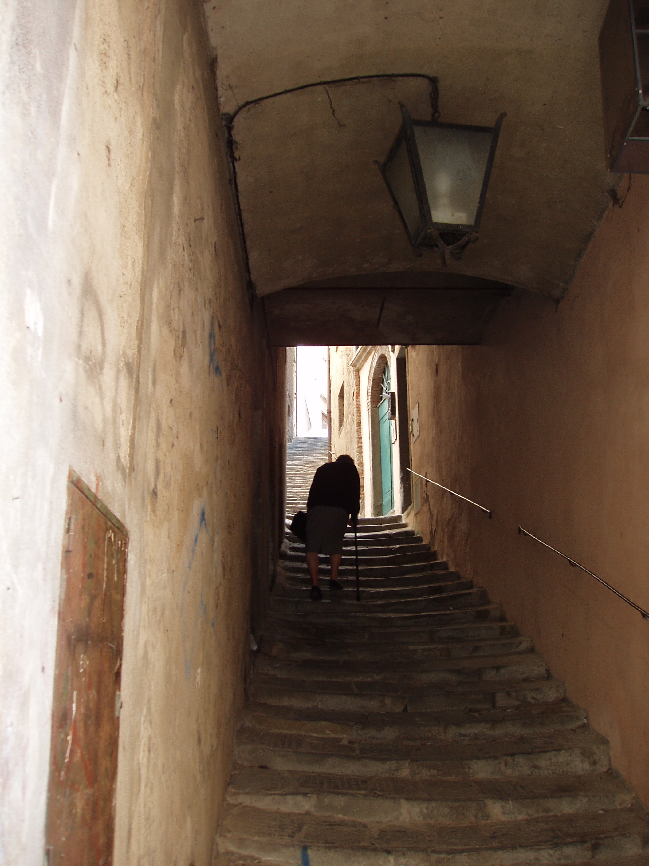 Pensioner climbs the stairs in italy free image download