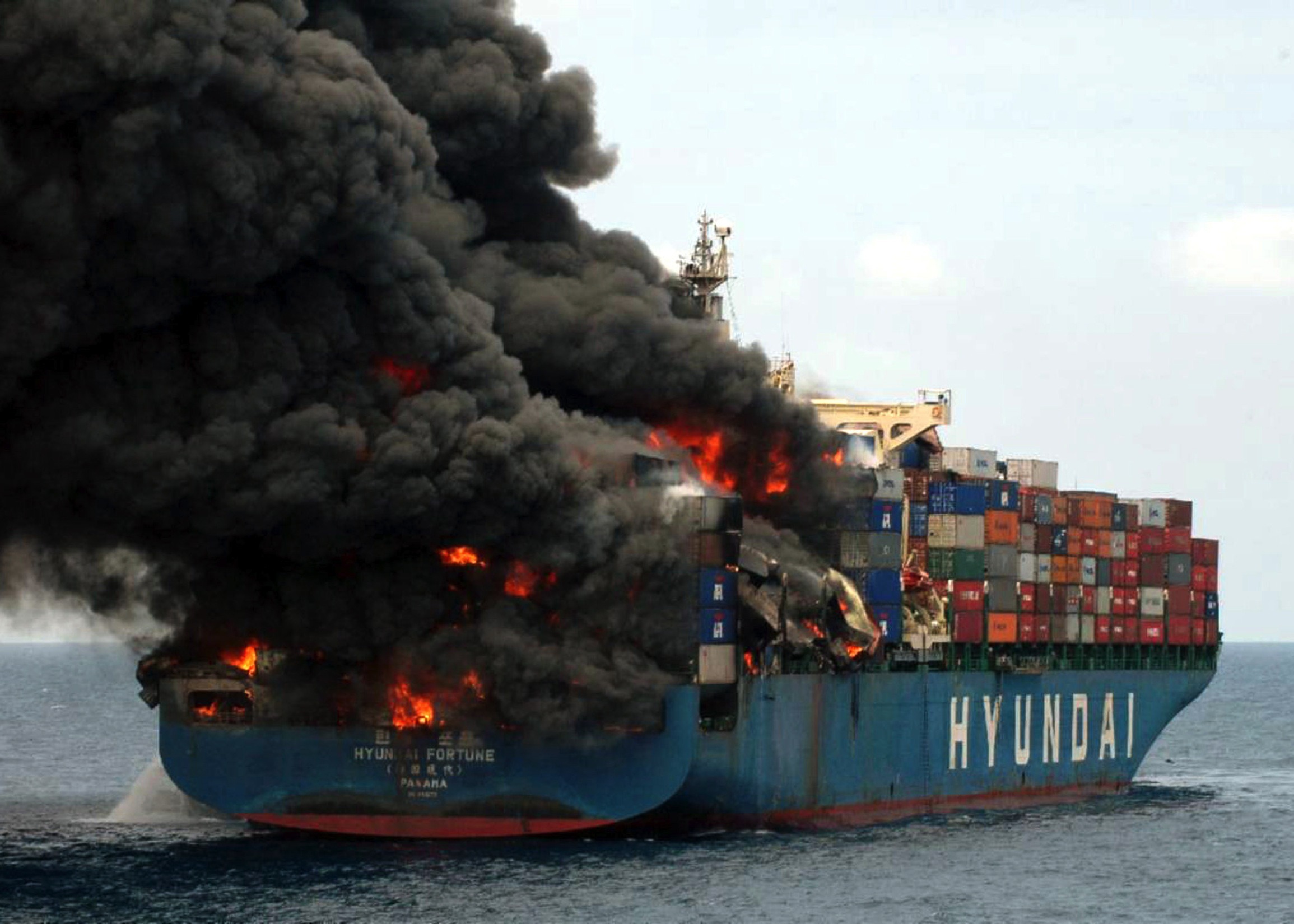 Burning ship with black smoke free image download