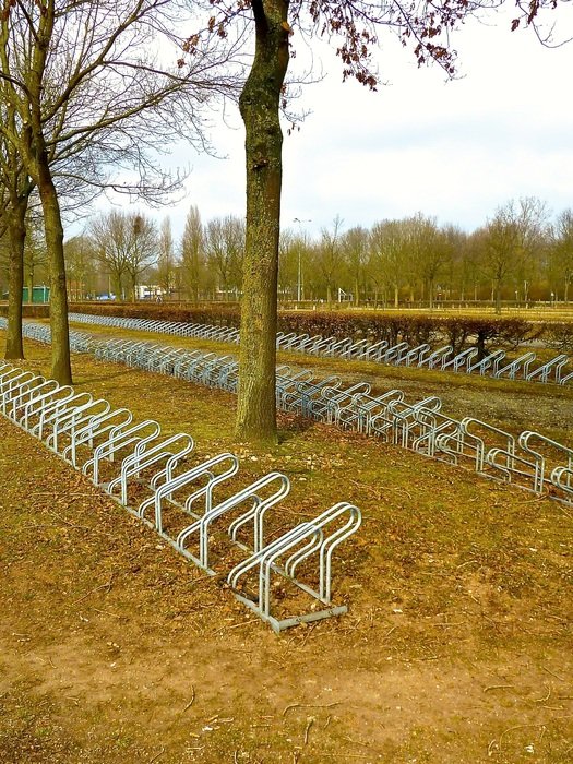 Bicycle racks for parking in the park free image download