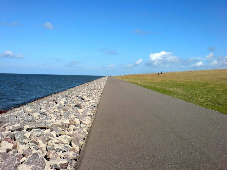 Asphalt road along seashore free image download