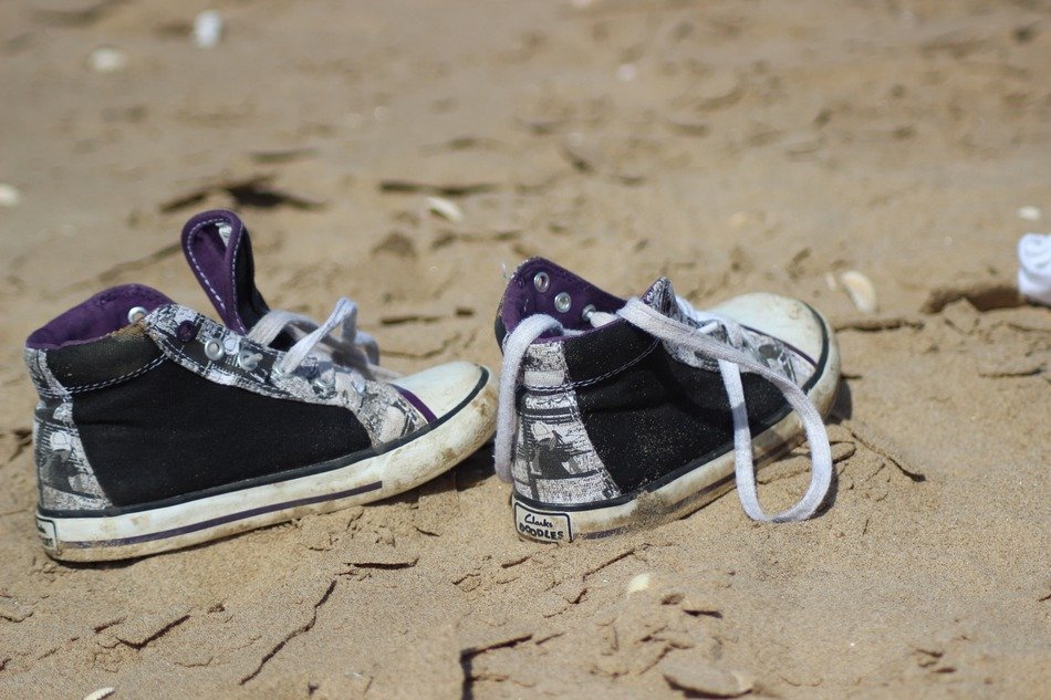 Shoes on sandy beach free image download