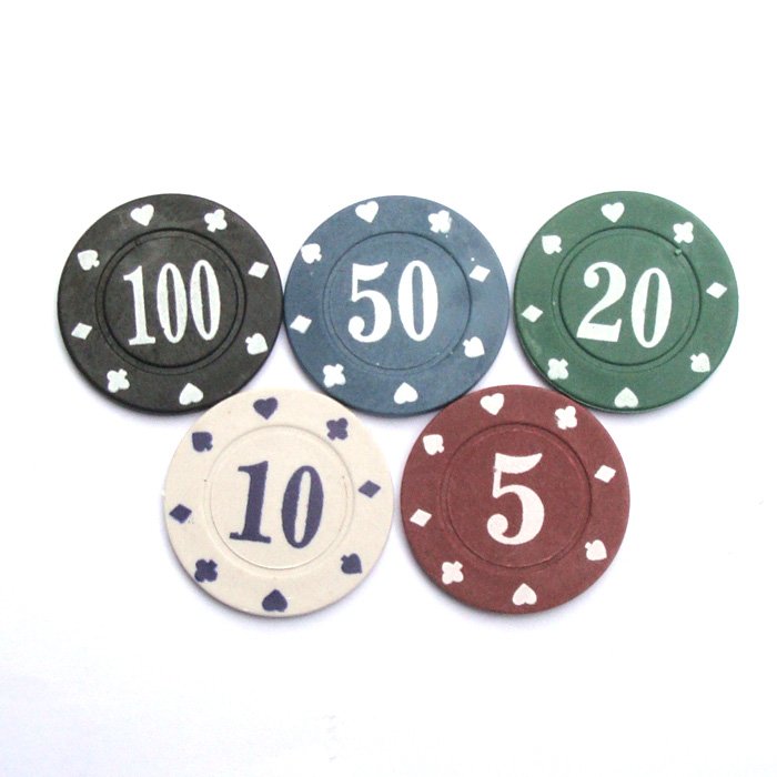 Poker chips of different denominations in a casino free image download
