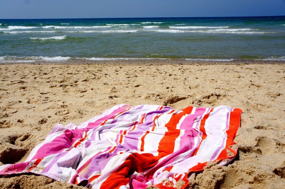 Beach towel on sand free image download