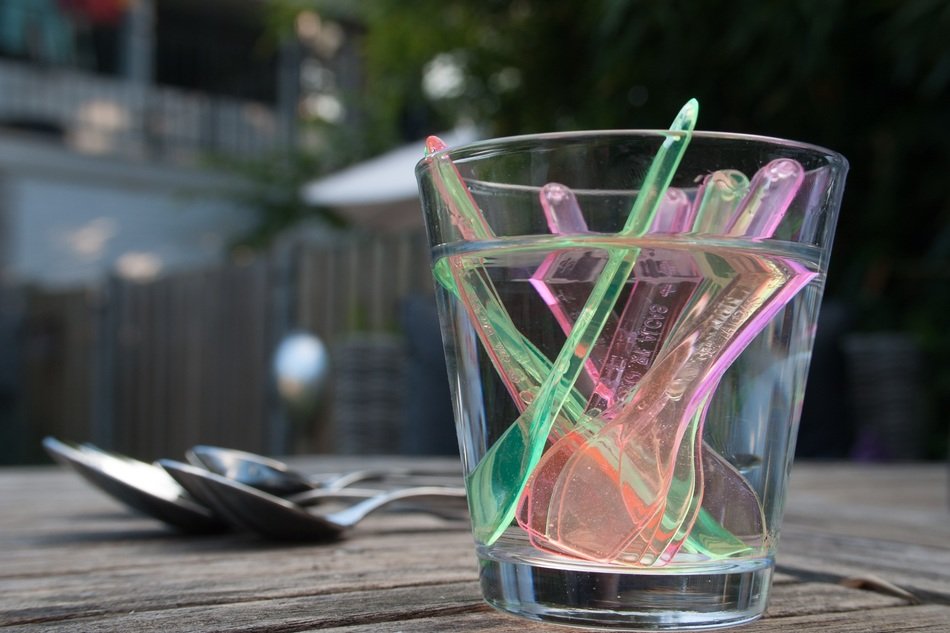 Plastic spoons in a glass tumbler free image download