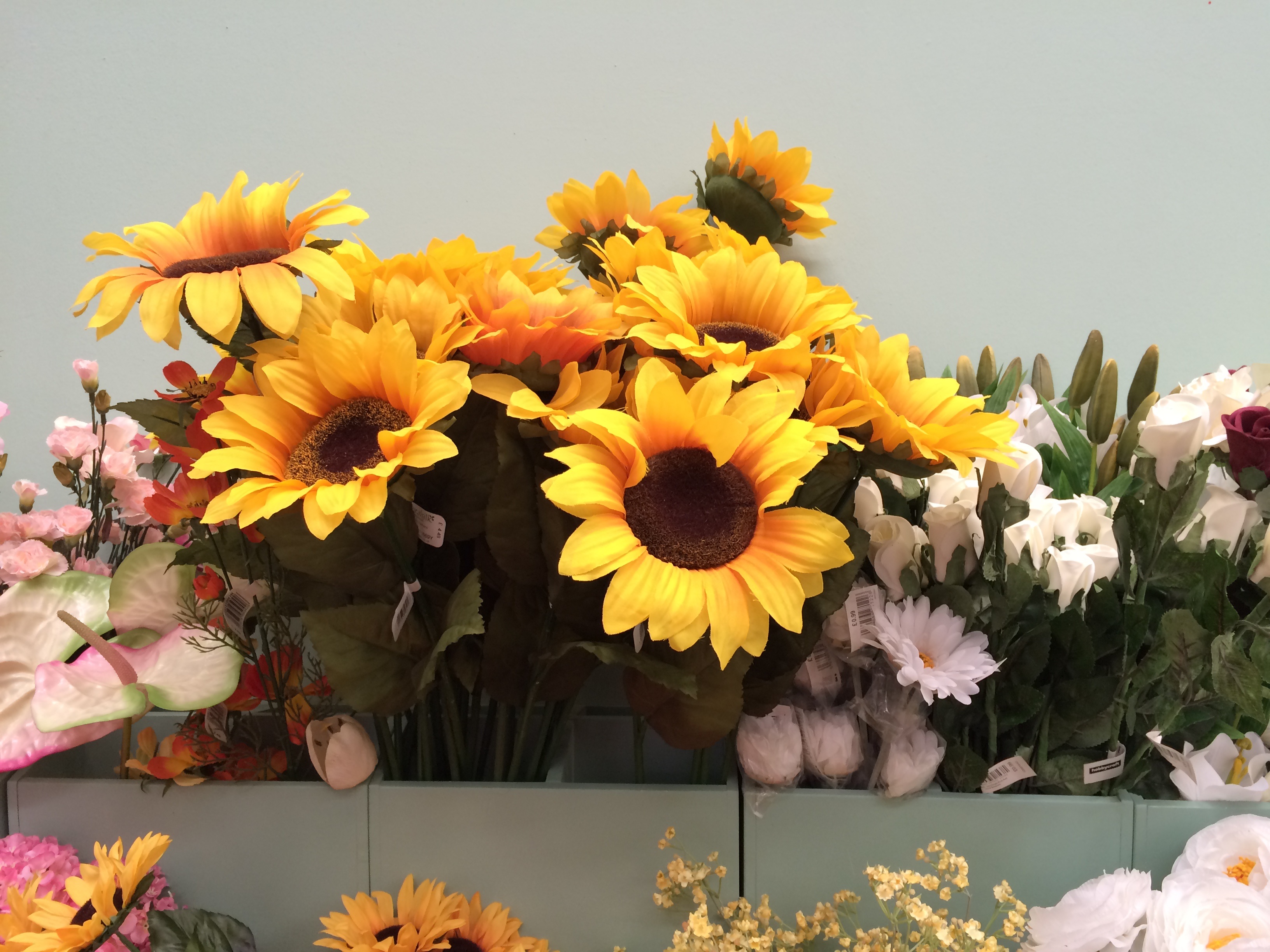 Multicolored artificial flowers in a pot free image download