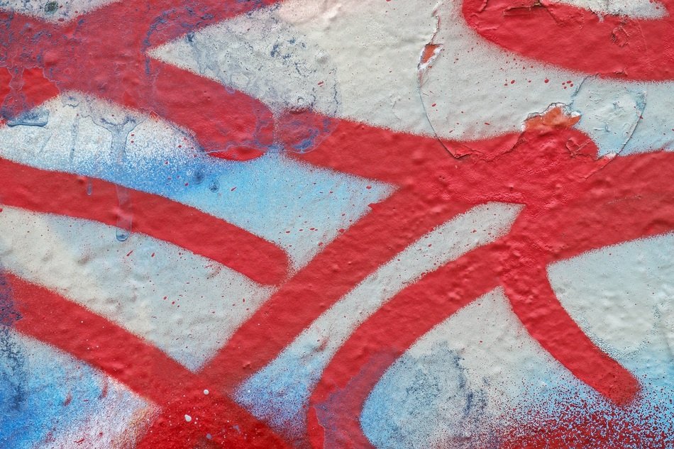 Red graffiti on the weathered wall free image download