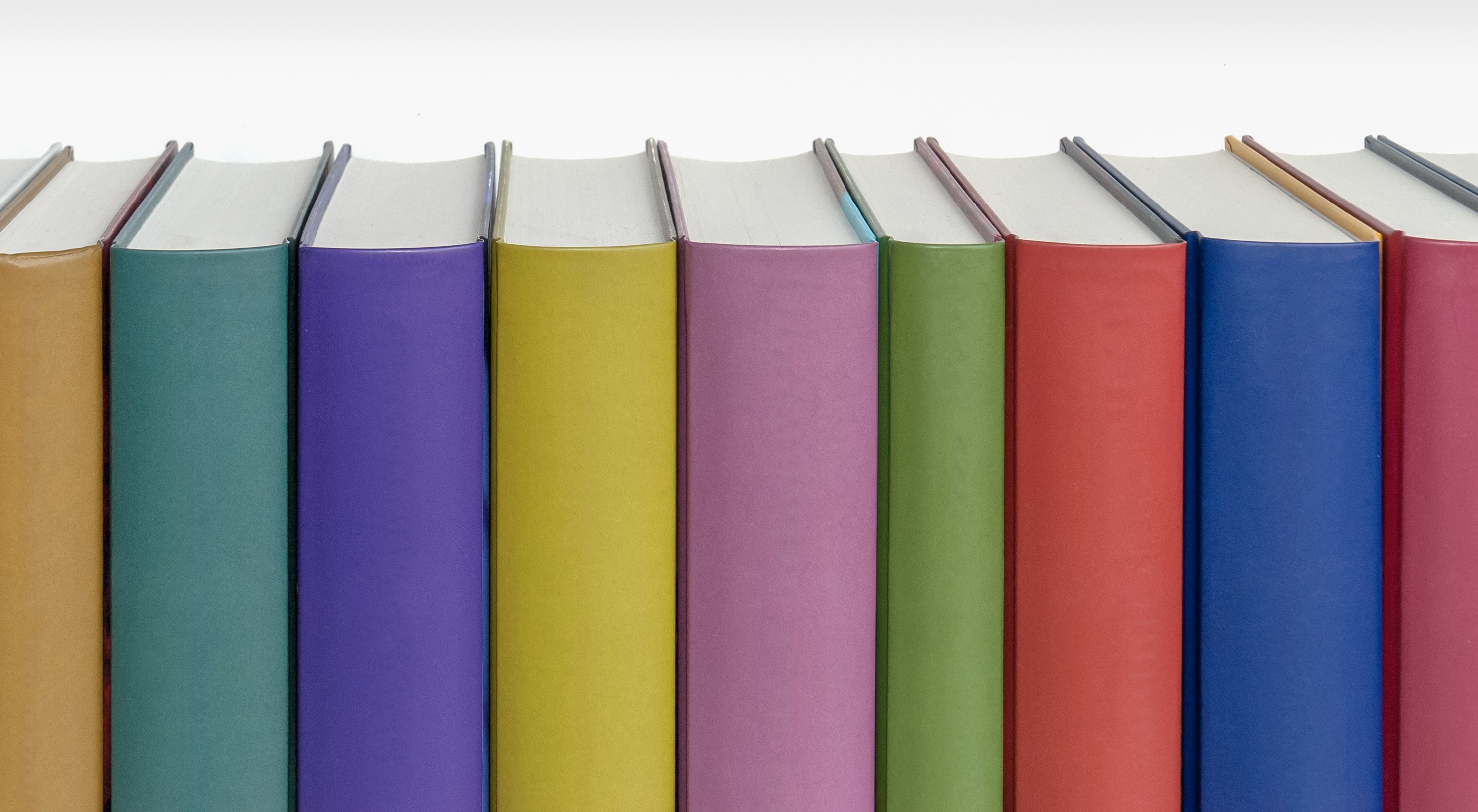 Different colorful books on the shelf free image download