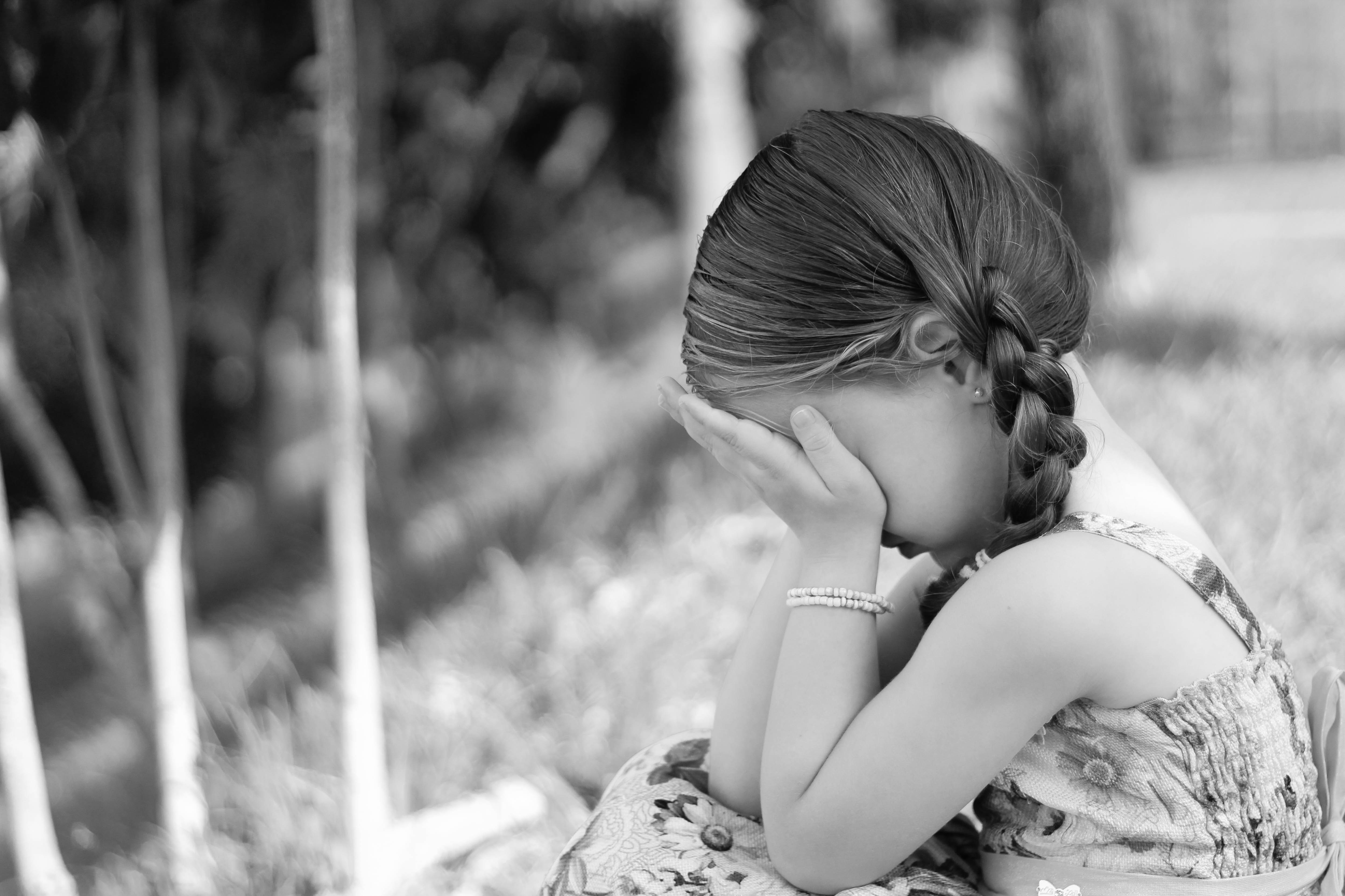 Crying little girl in profile free image download