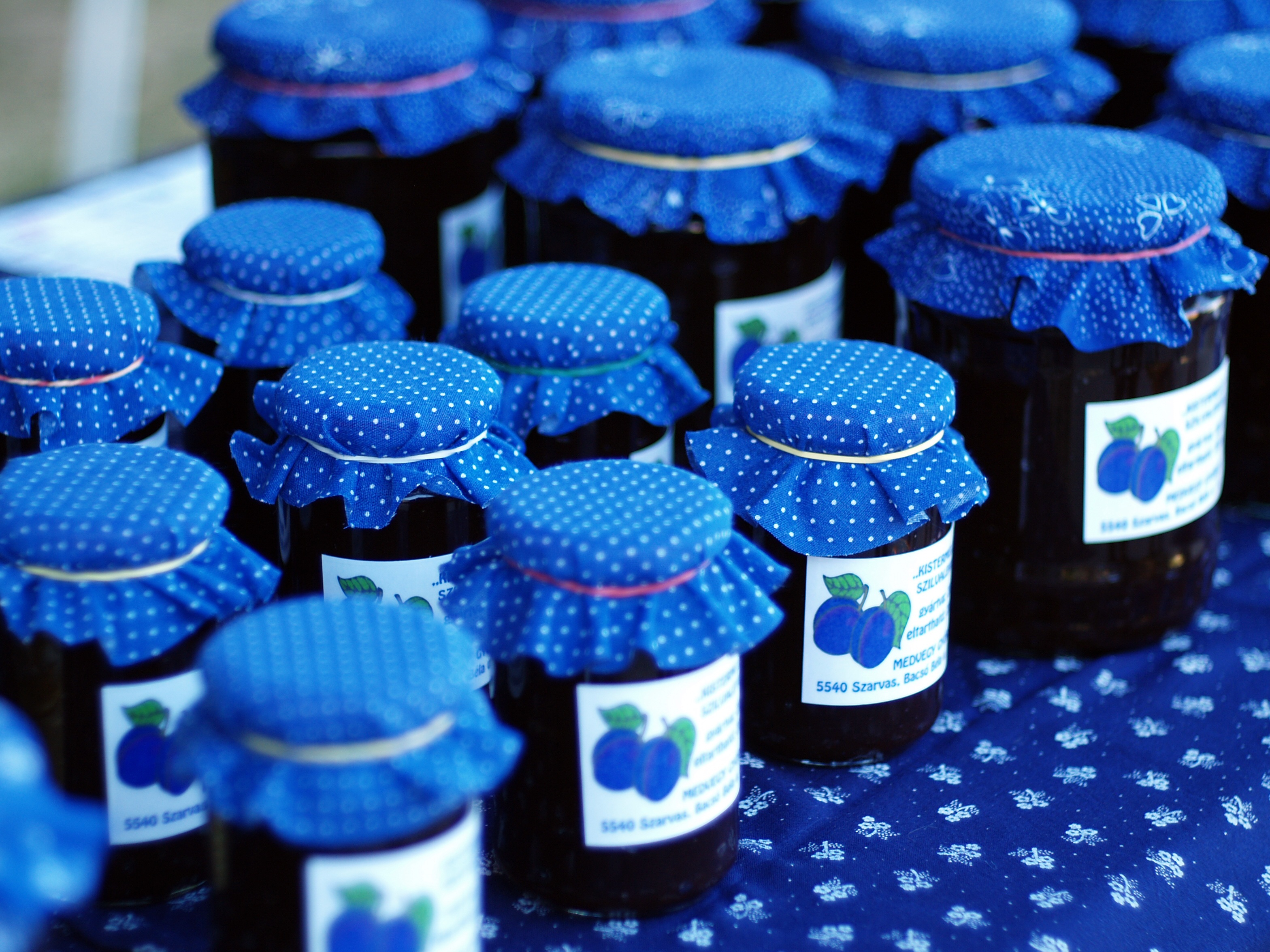 Plum jam in jars with a blue lid free image download
