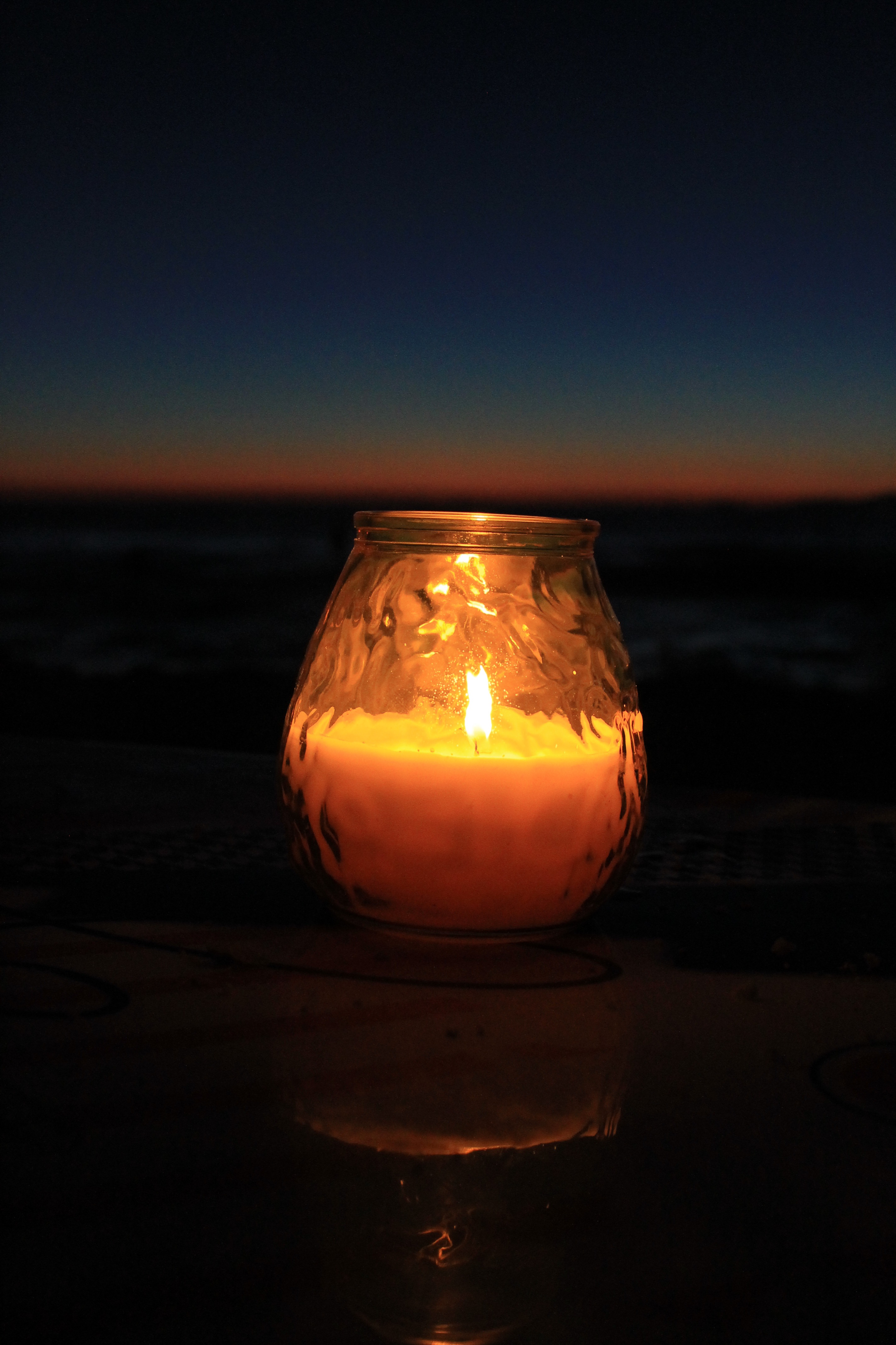 Lighting candle on the beach free image download
