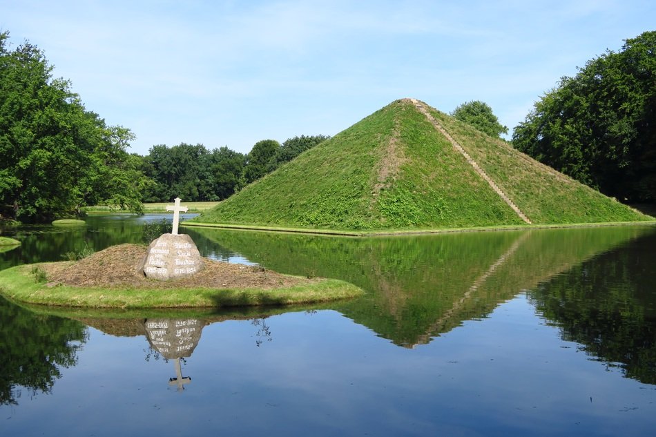 Green Pyramid on a lake free image download