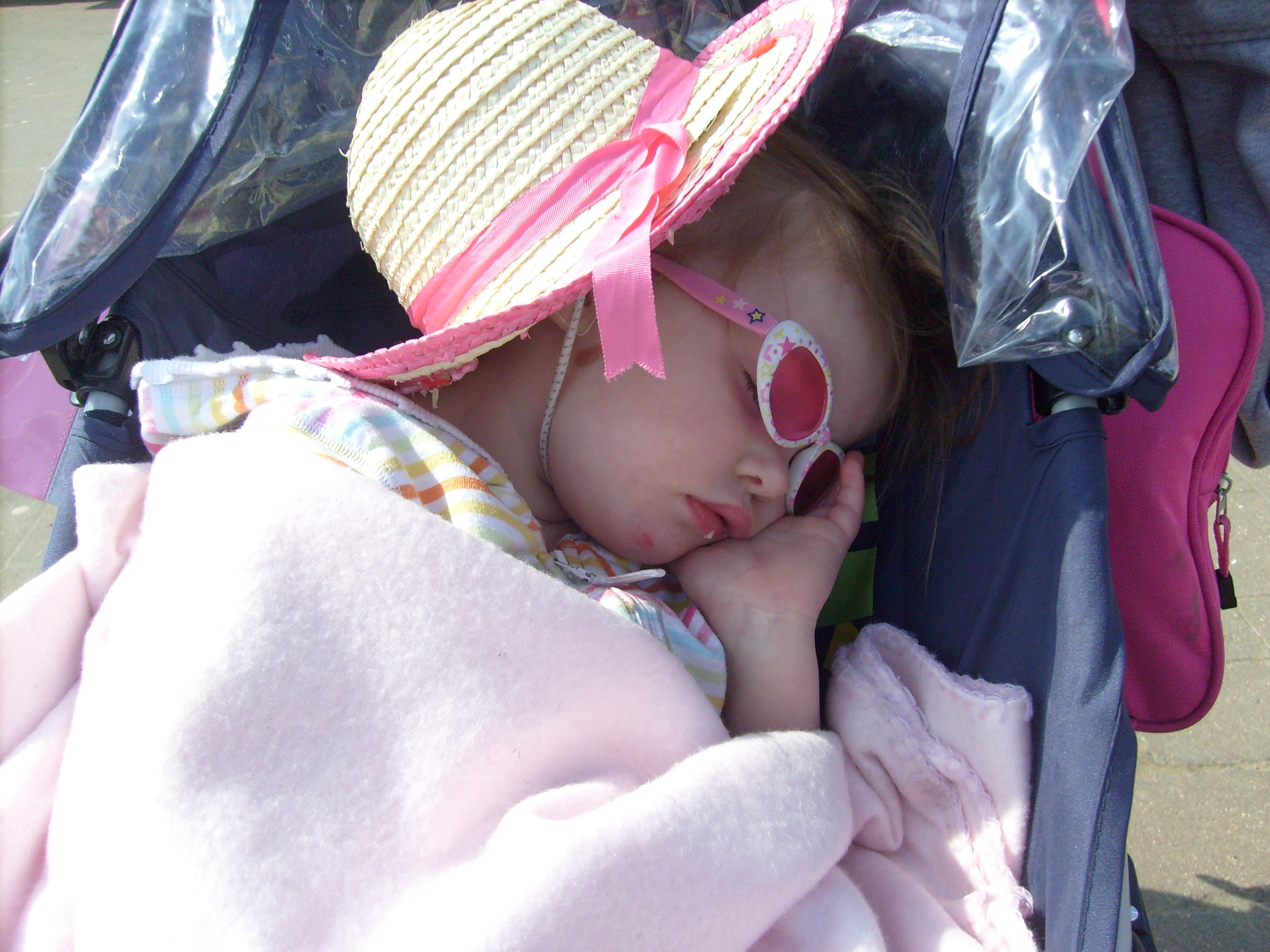 Little girl is sleeping in a wheelchair free image download