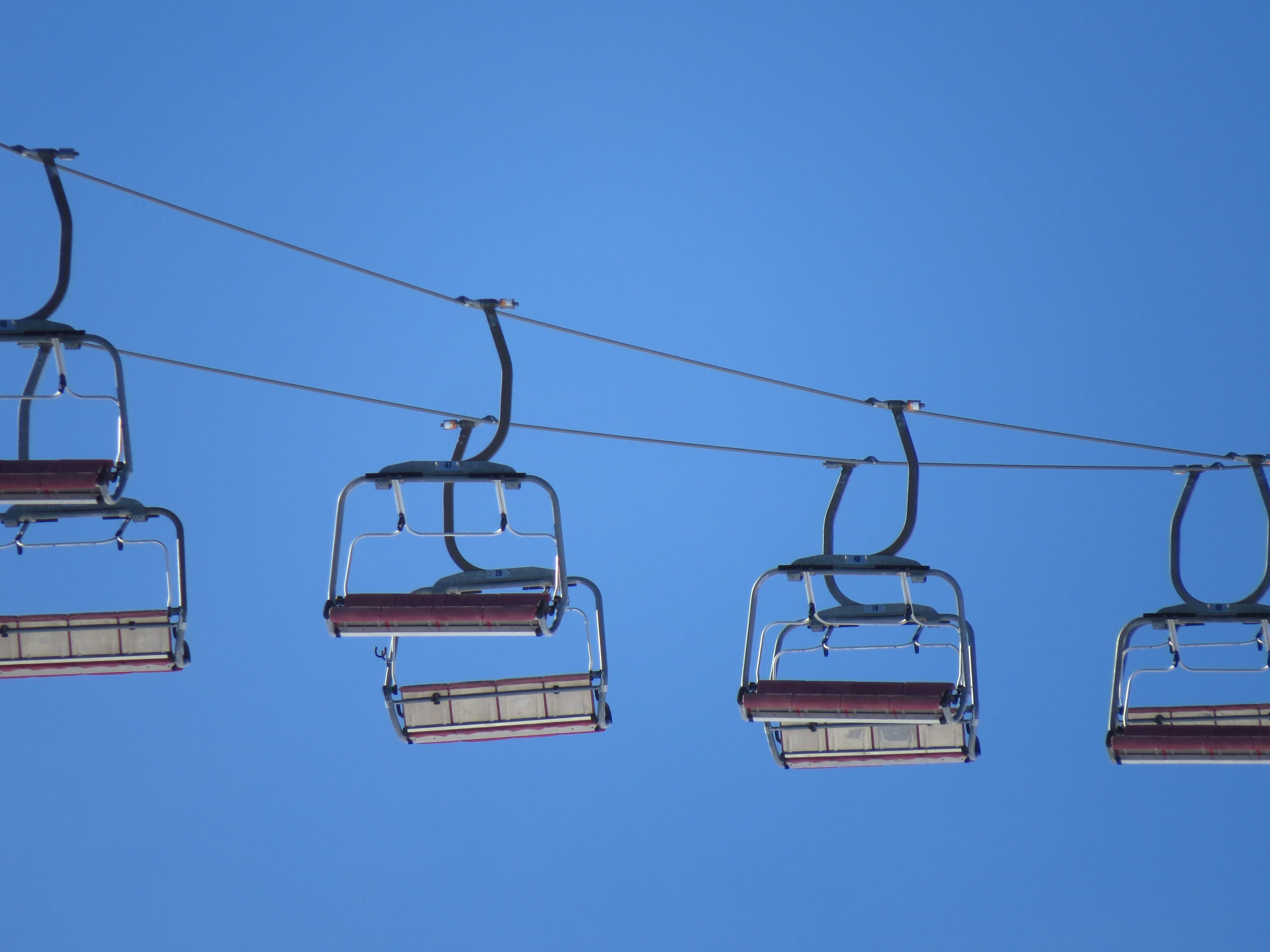 Ski lifts on the blue sky free image download