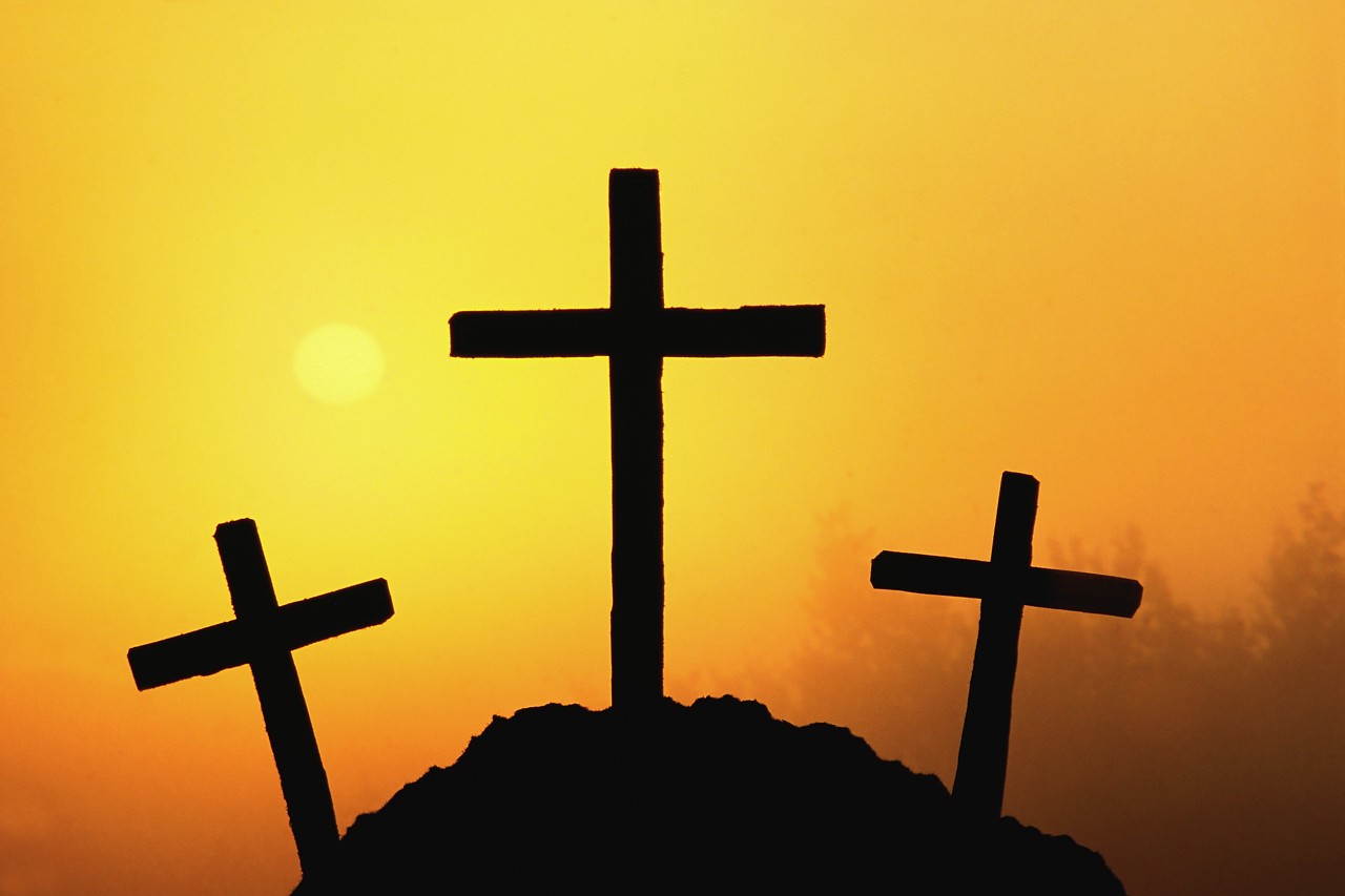 Three black Crosses on hill at orange sky free image download