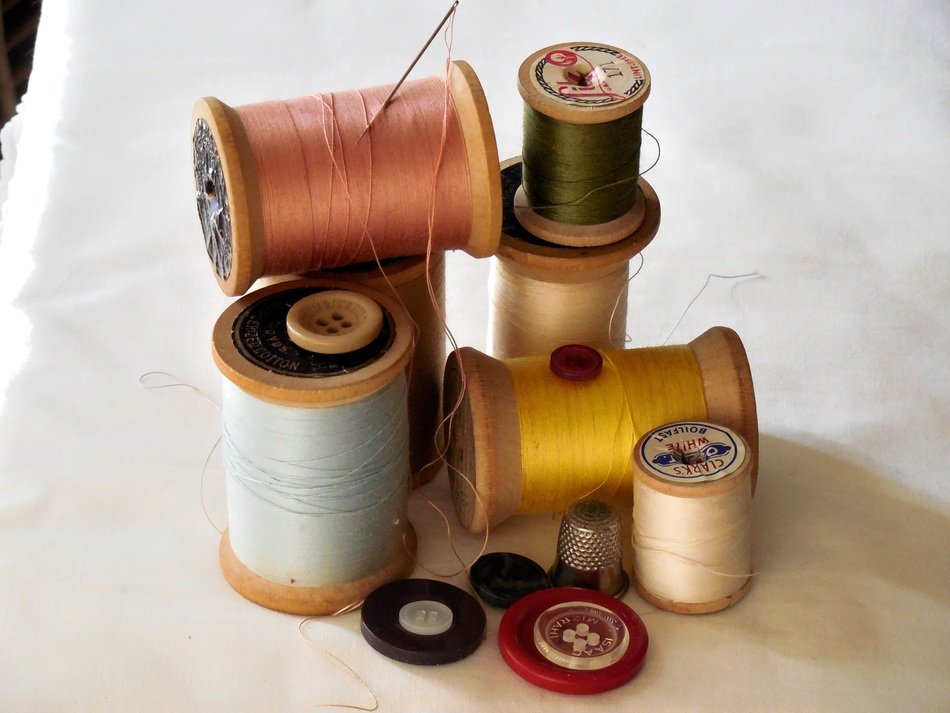 Sewing accessories, needle, thread and colored buttons free image download