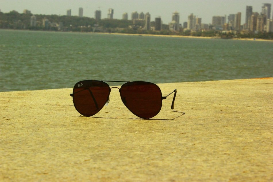 Sunglasses on the beach in Mumbai free image download