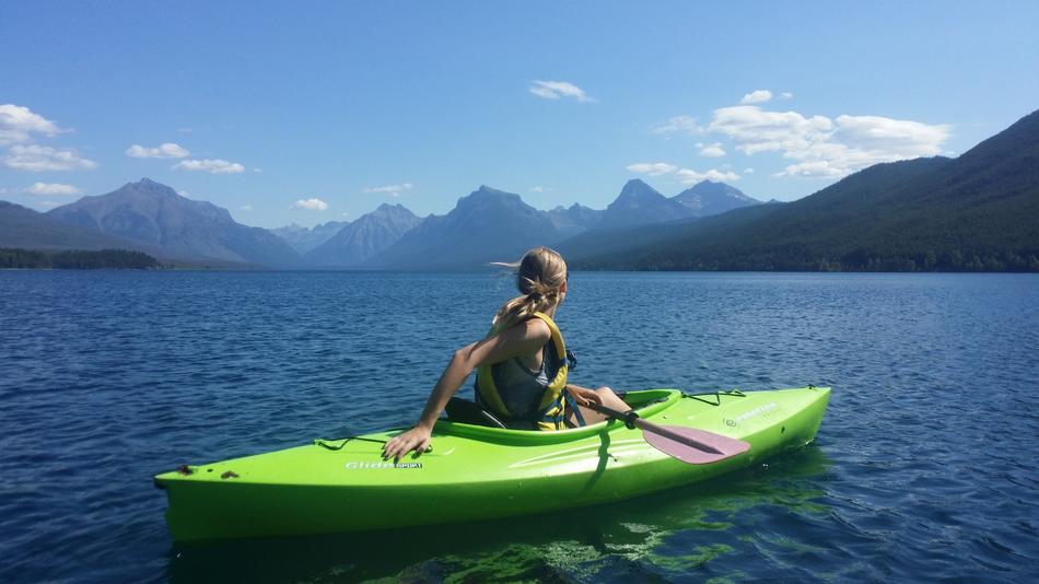 Kayaking woman on mountain lake free image download