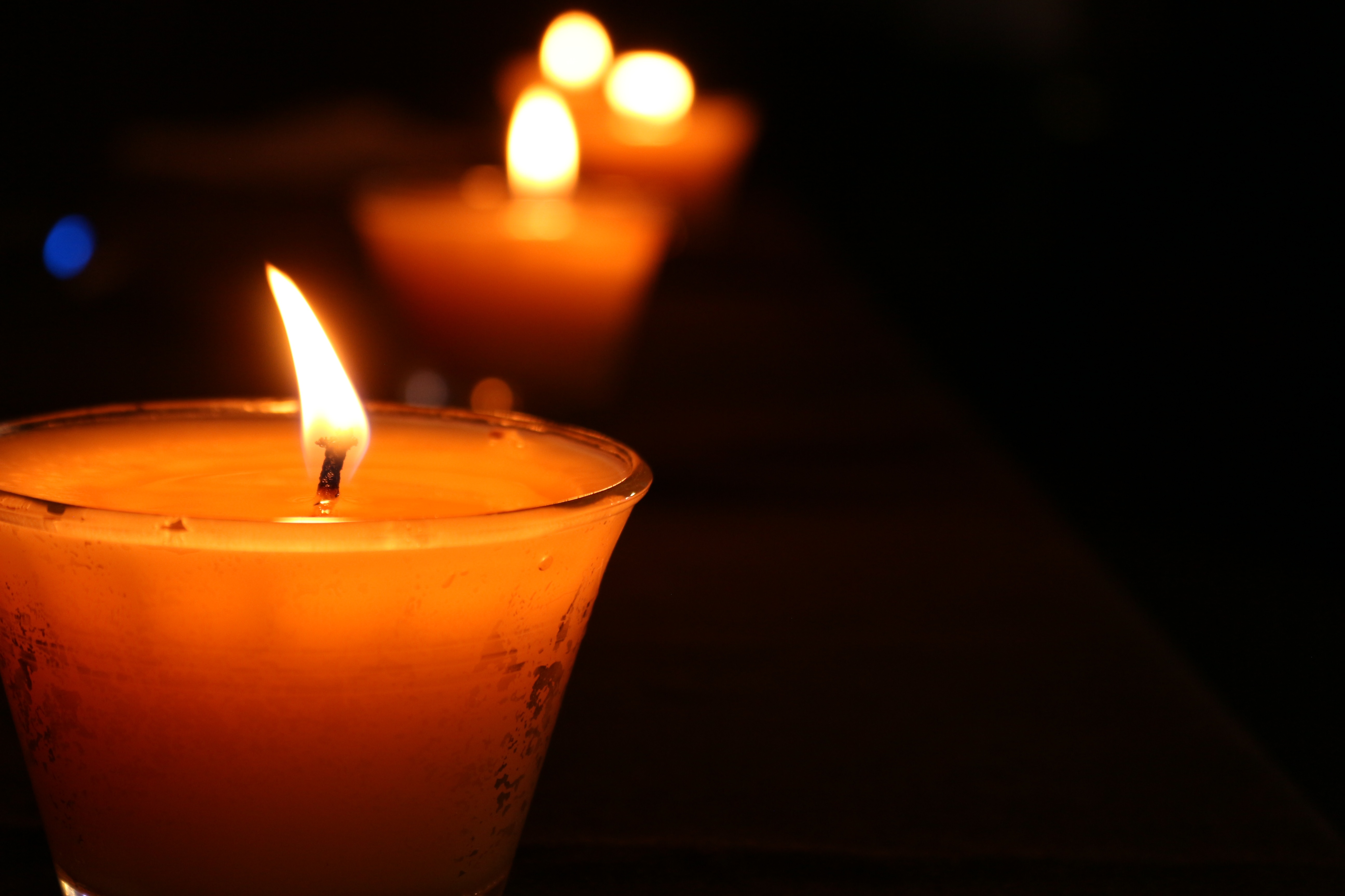 Burning candles in glass candlesticks in the dark free image download