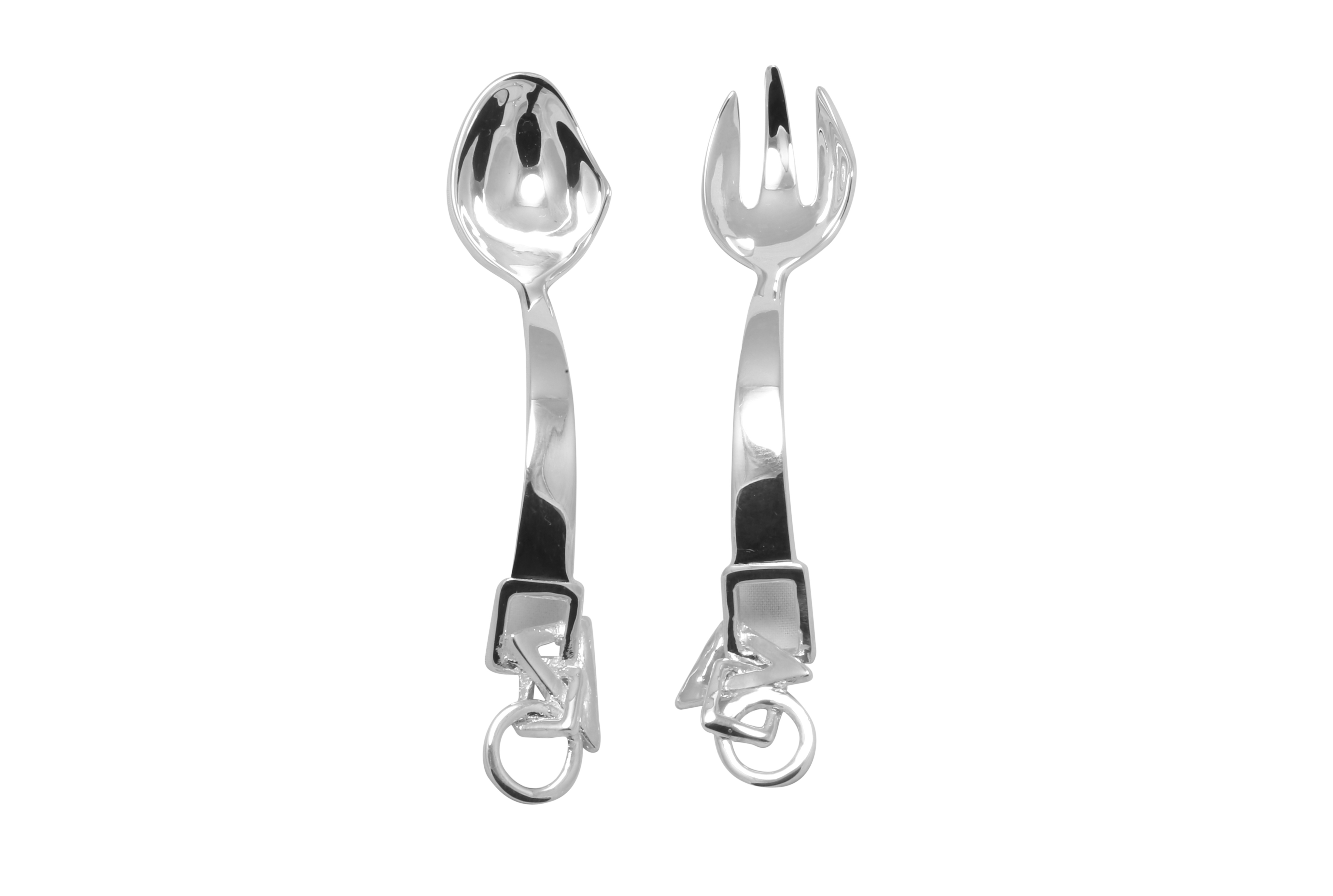 Two silver spoons on a white tablecloth free image download