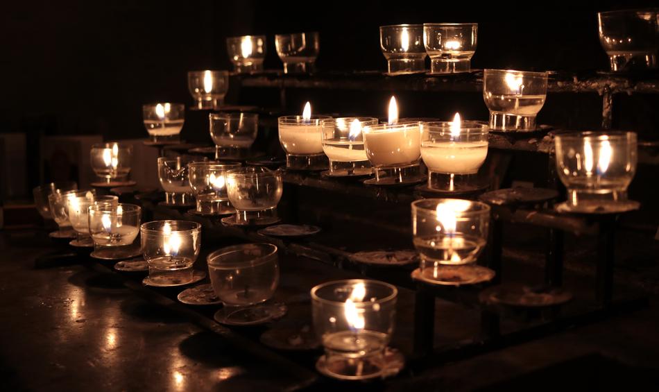 Prayer Candles burning in darkness free image download