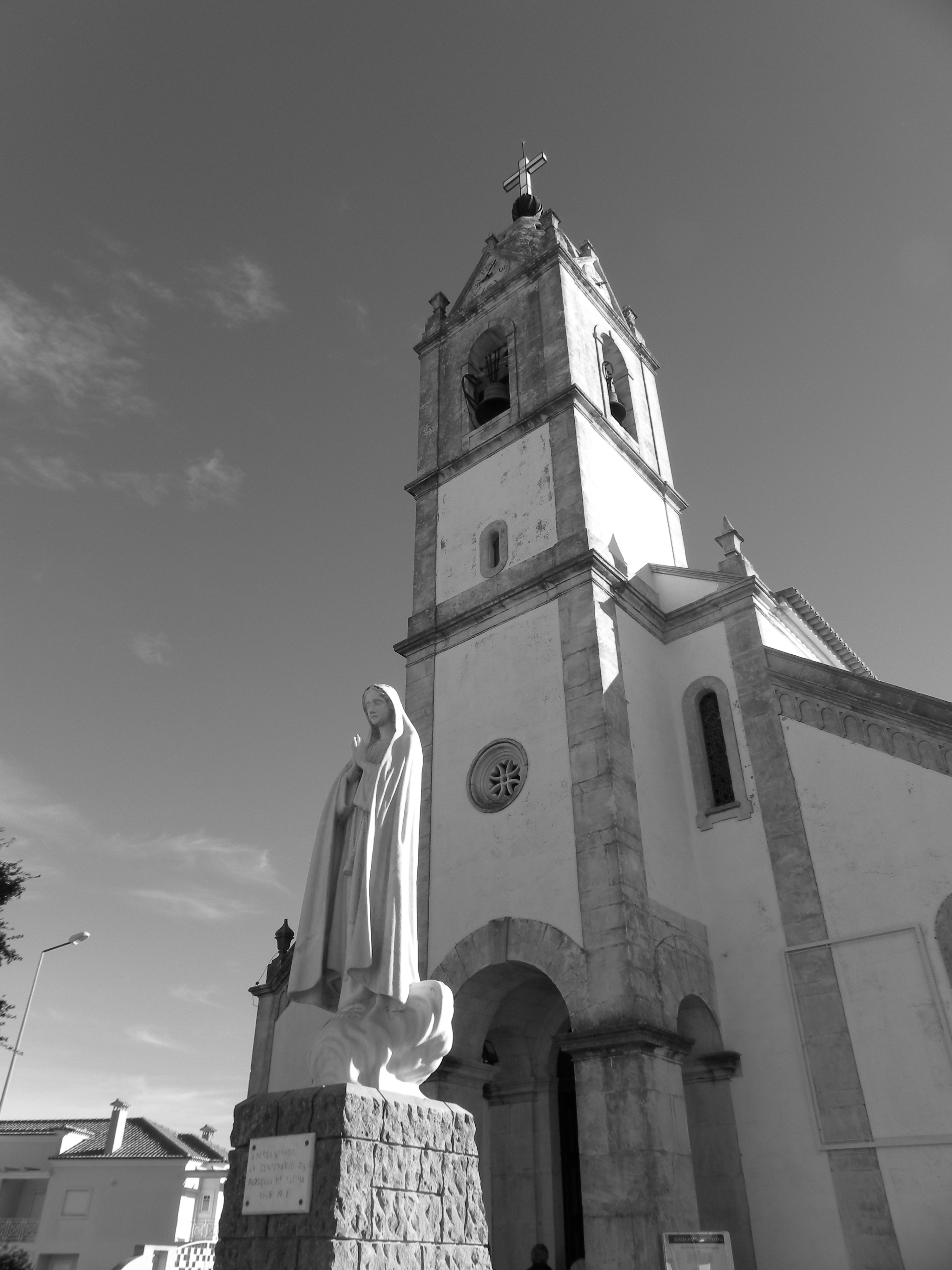 Black and white photo of the beautiful church and statue in Fatima