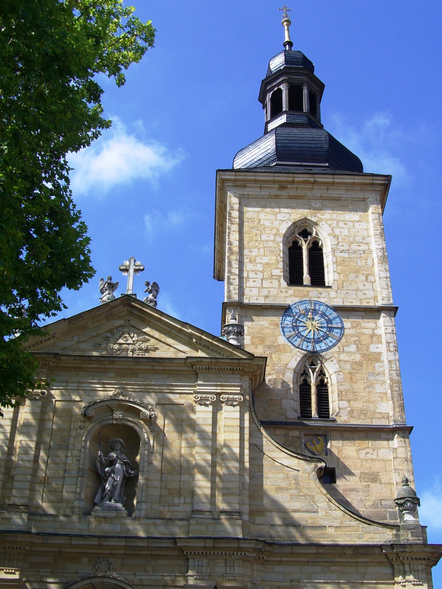 Church of saint jacob with a tower near a tree free image download
