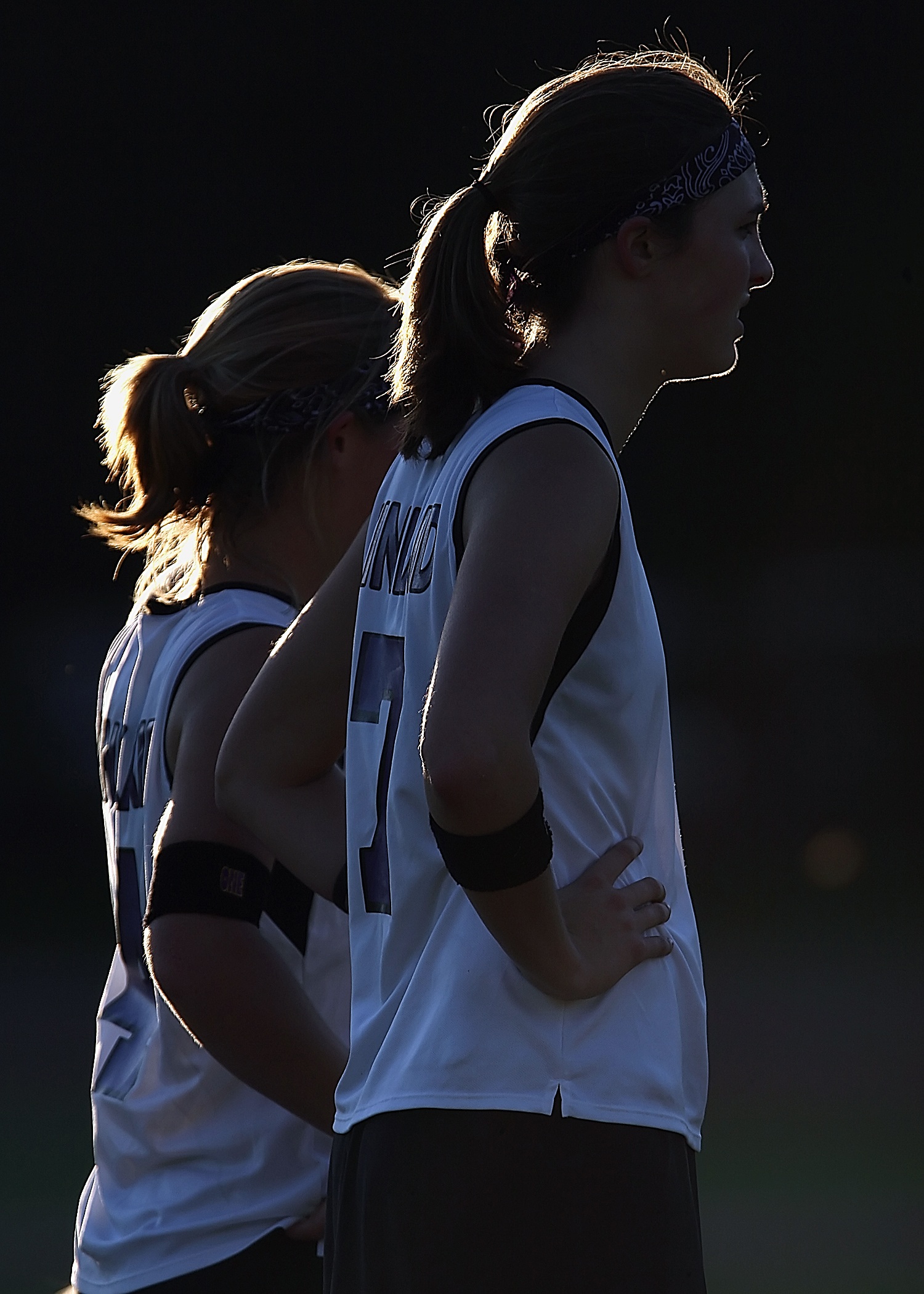 Female athletes in uniform at sunset free image download