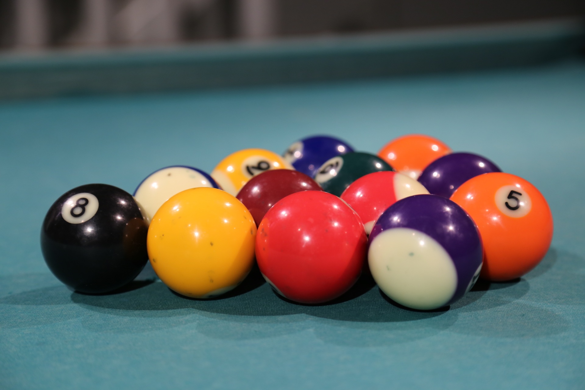 Closeup of the colorful, shiny billiard balls, on the billiard table