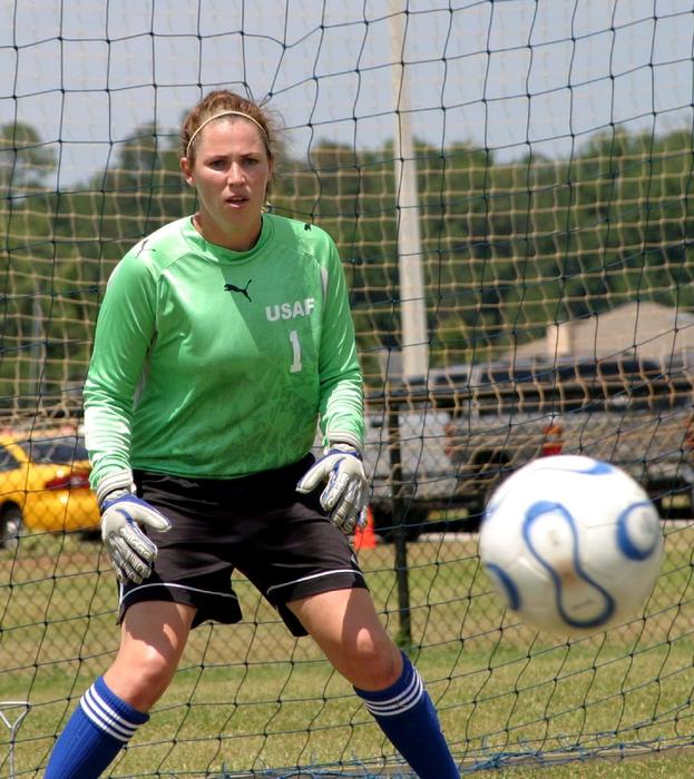 Girl goalkeeper catches the ball free image download