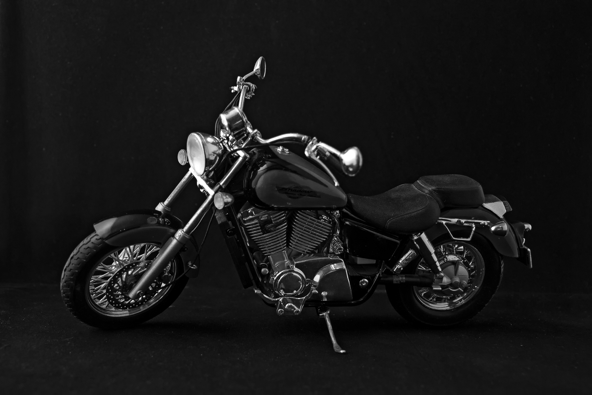 Chrome black motorcycle on black background free image download