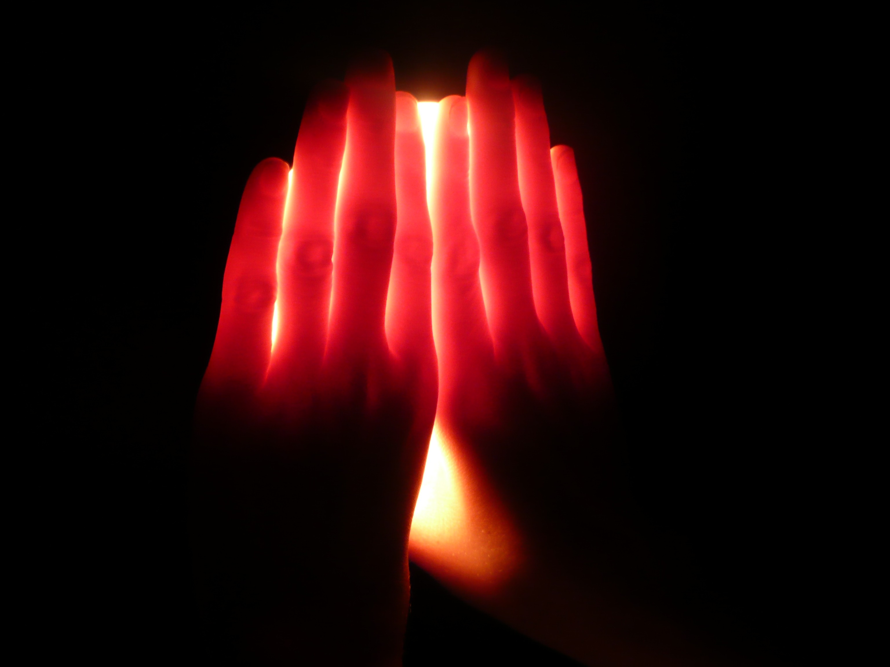 Hands on a luminous lamp free image download