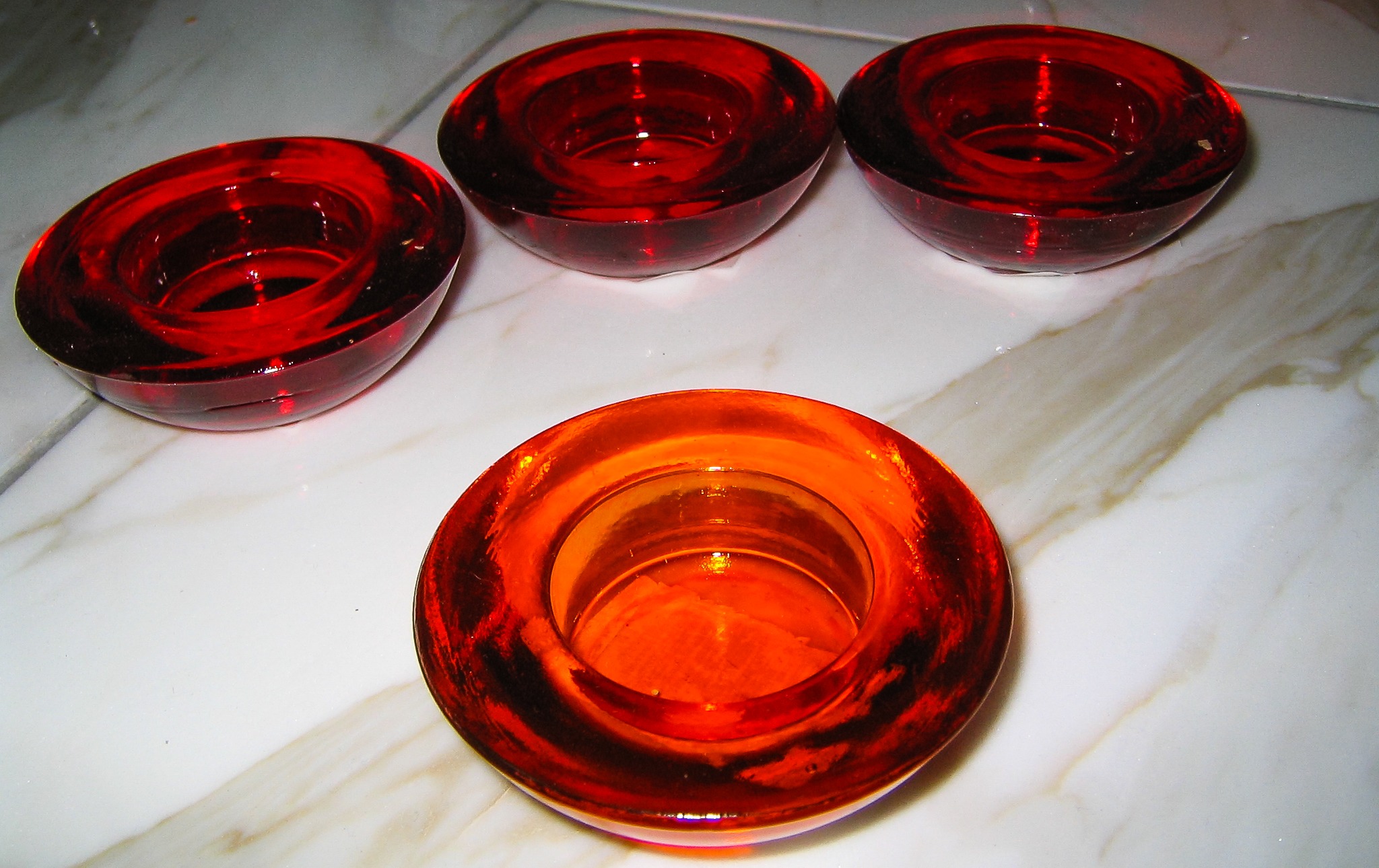 Four Red Glass Tea Light Holders free image download