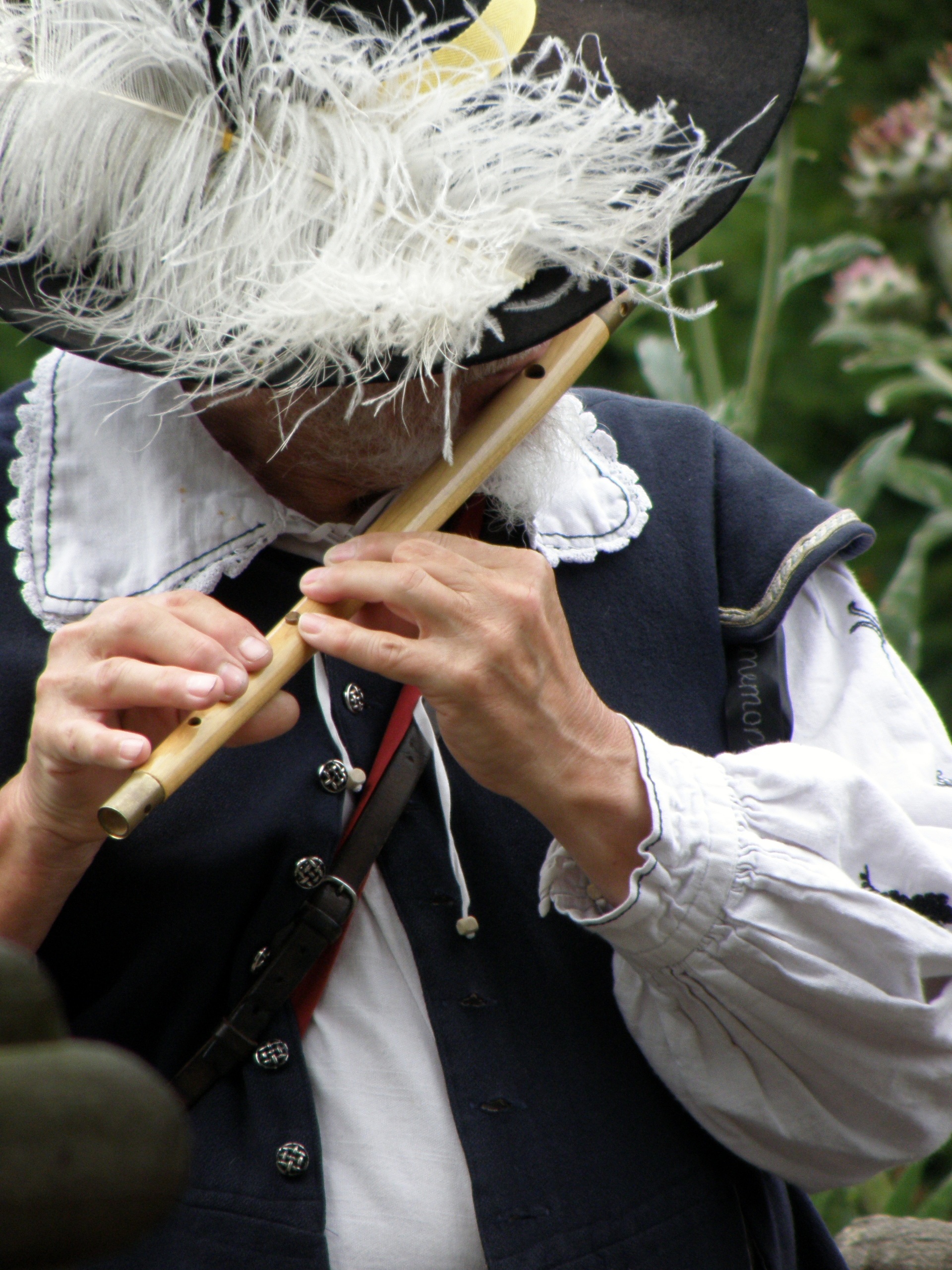 Musician in historical costume plays the flute free image download