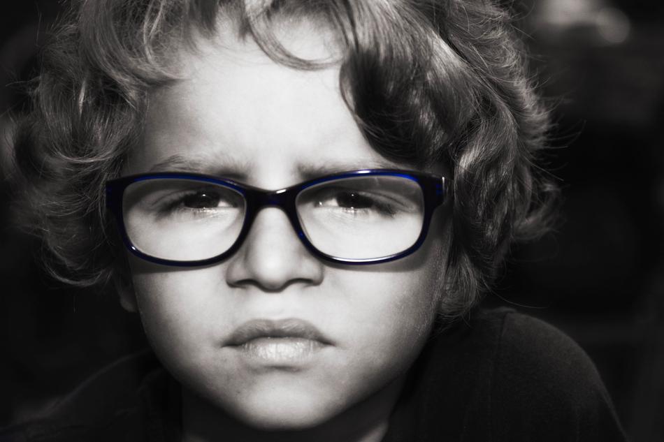 Black and white portrait of a sad boy with glasses free image download