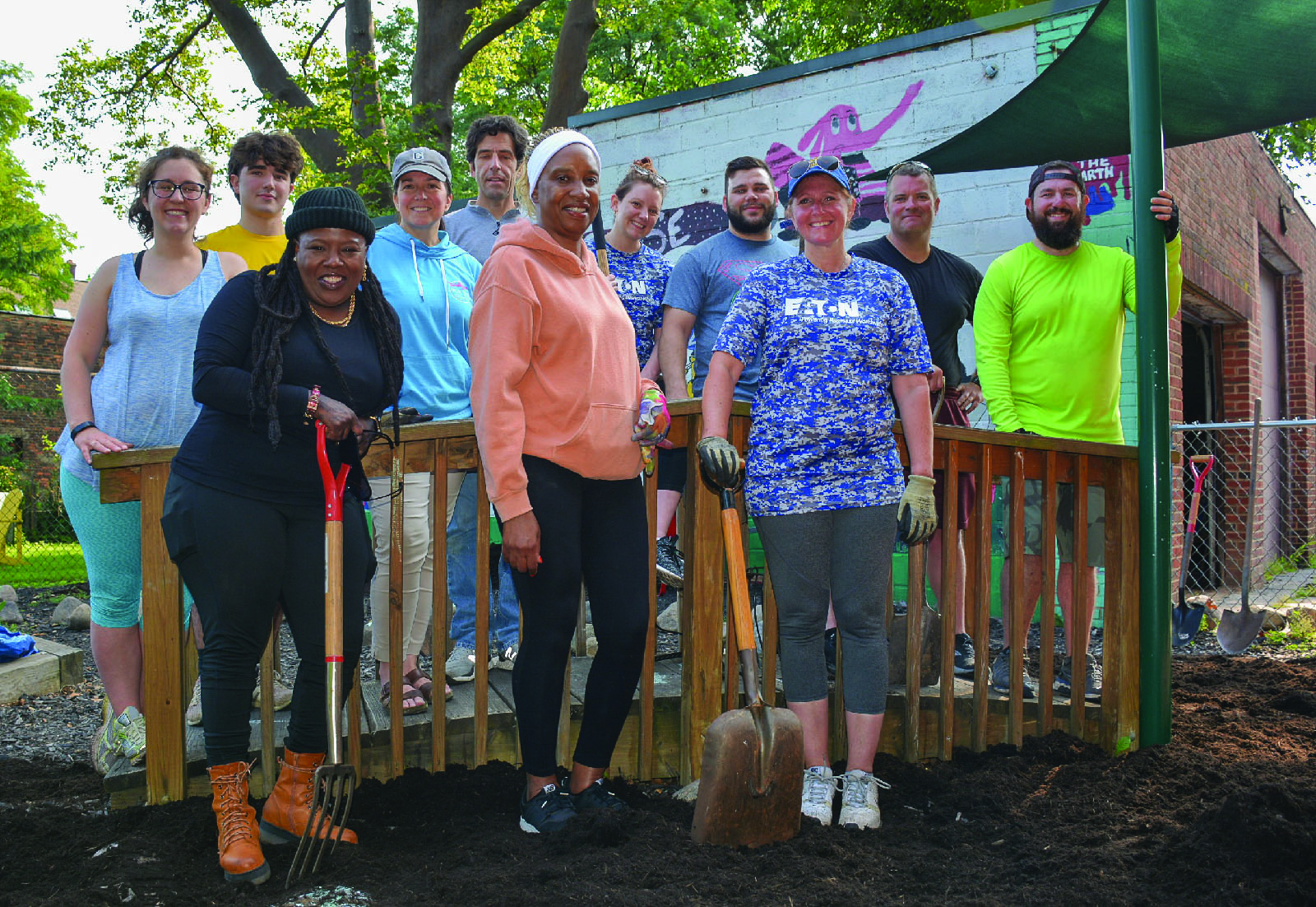 Volunteers fill Merrick House playground with mulch Plain Press