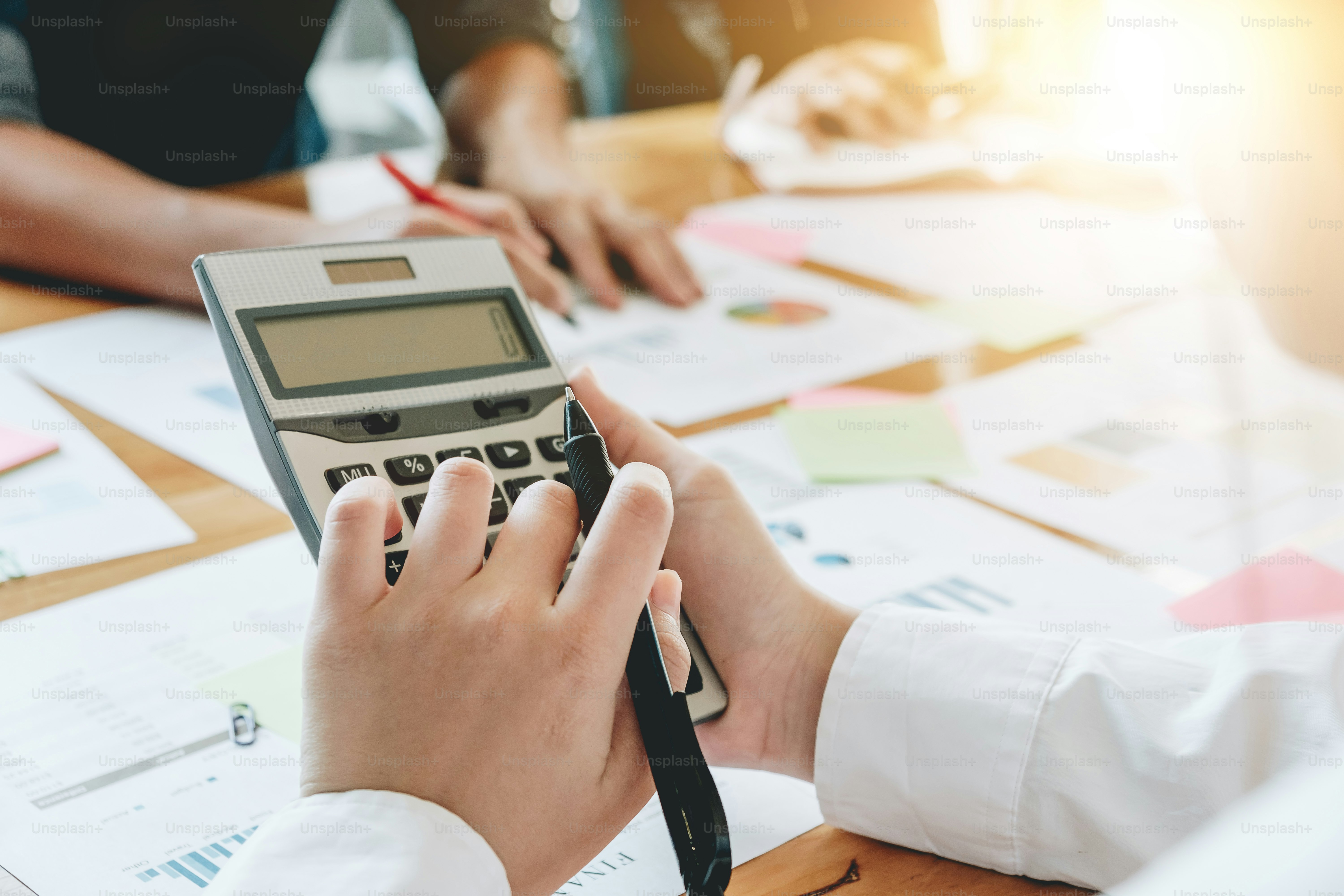Businesswoman holding calculator for calculate financial data at