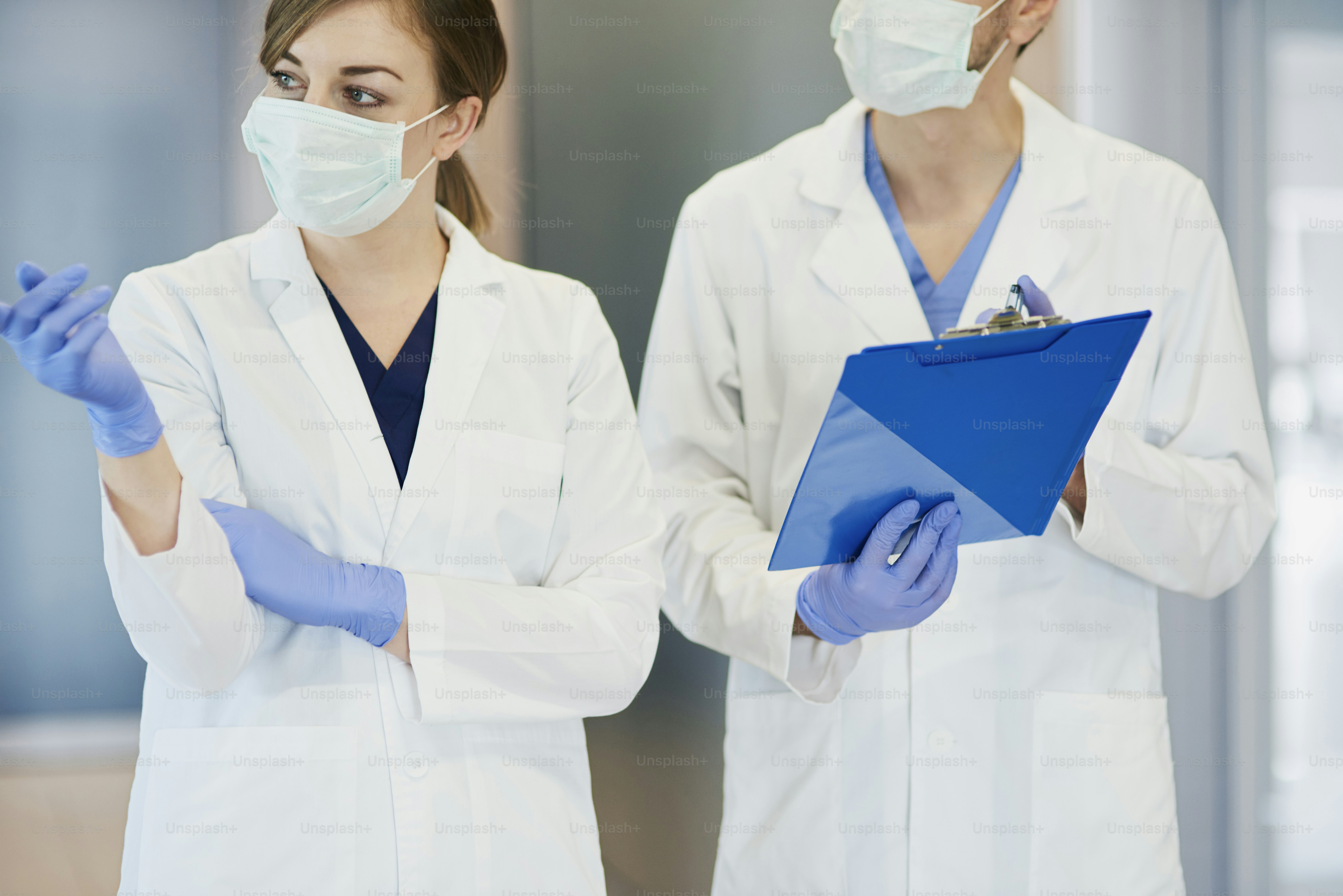 Two doctors in protective masks photo Poland Image on Unsplash